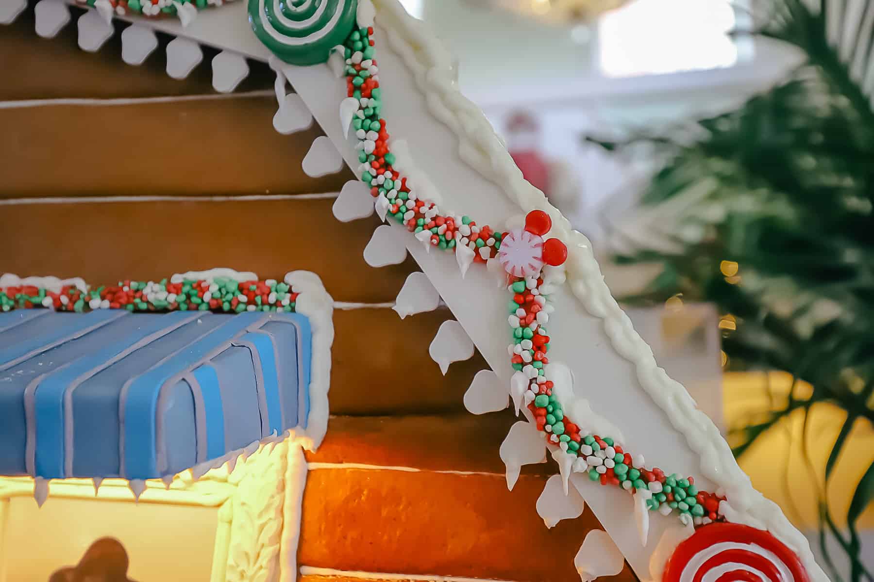 candy garland with hidden Mickey's on the gingerbread house 