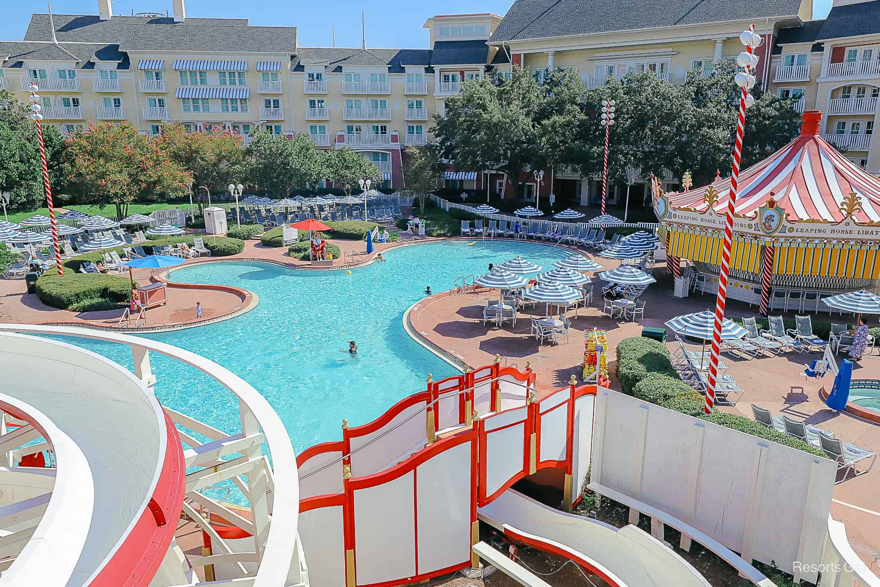 a view of the pool area from the top of the water slide platform 