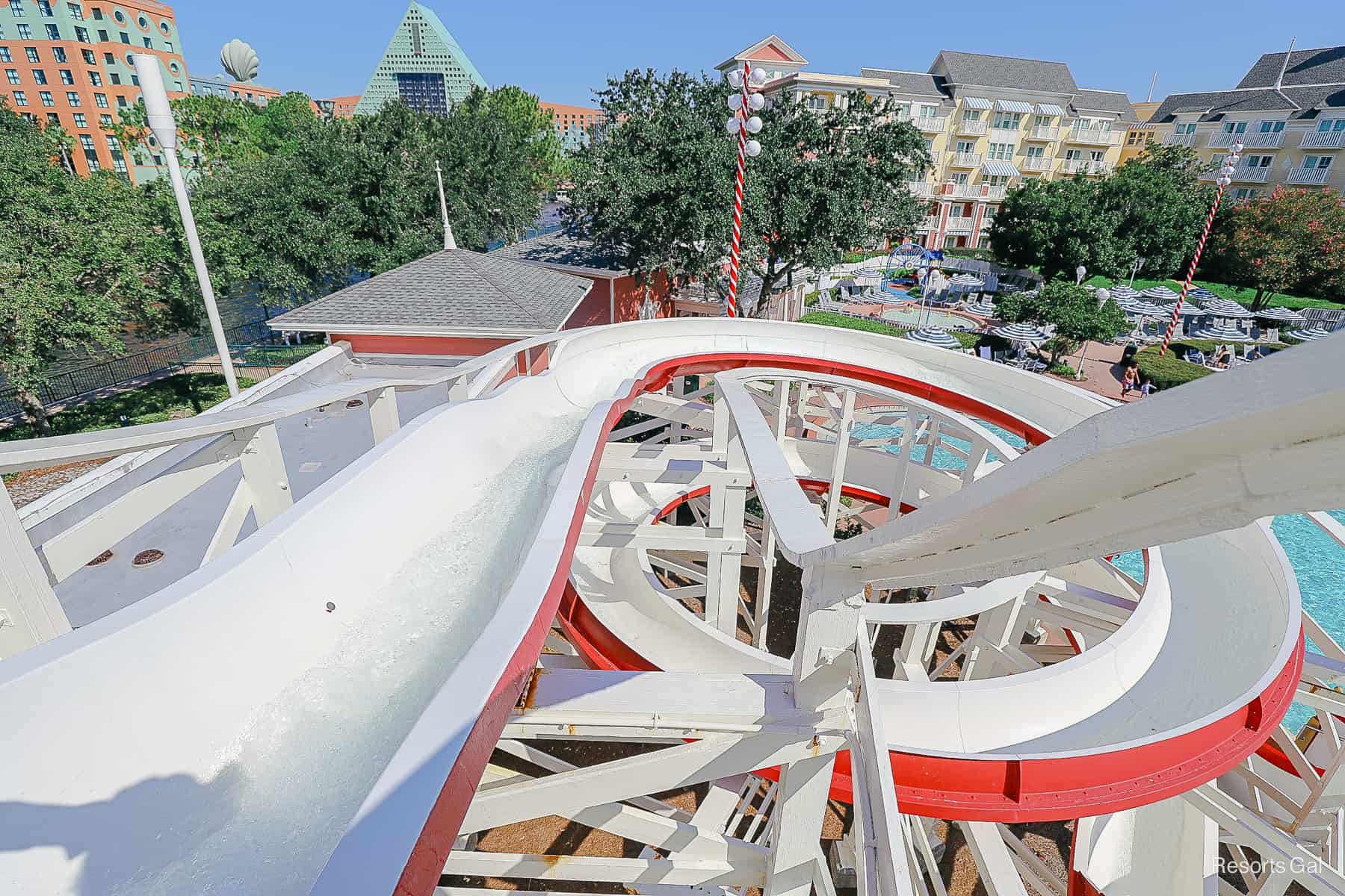 the frame and loops of the slide as it makes it way to the pool 