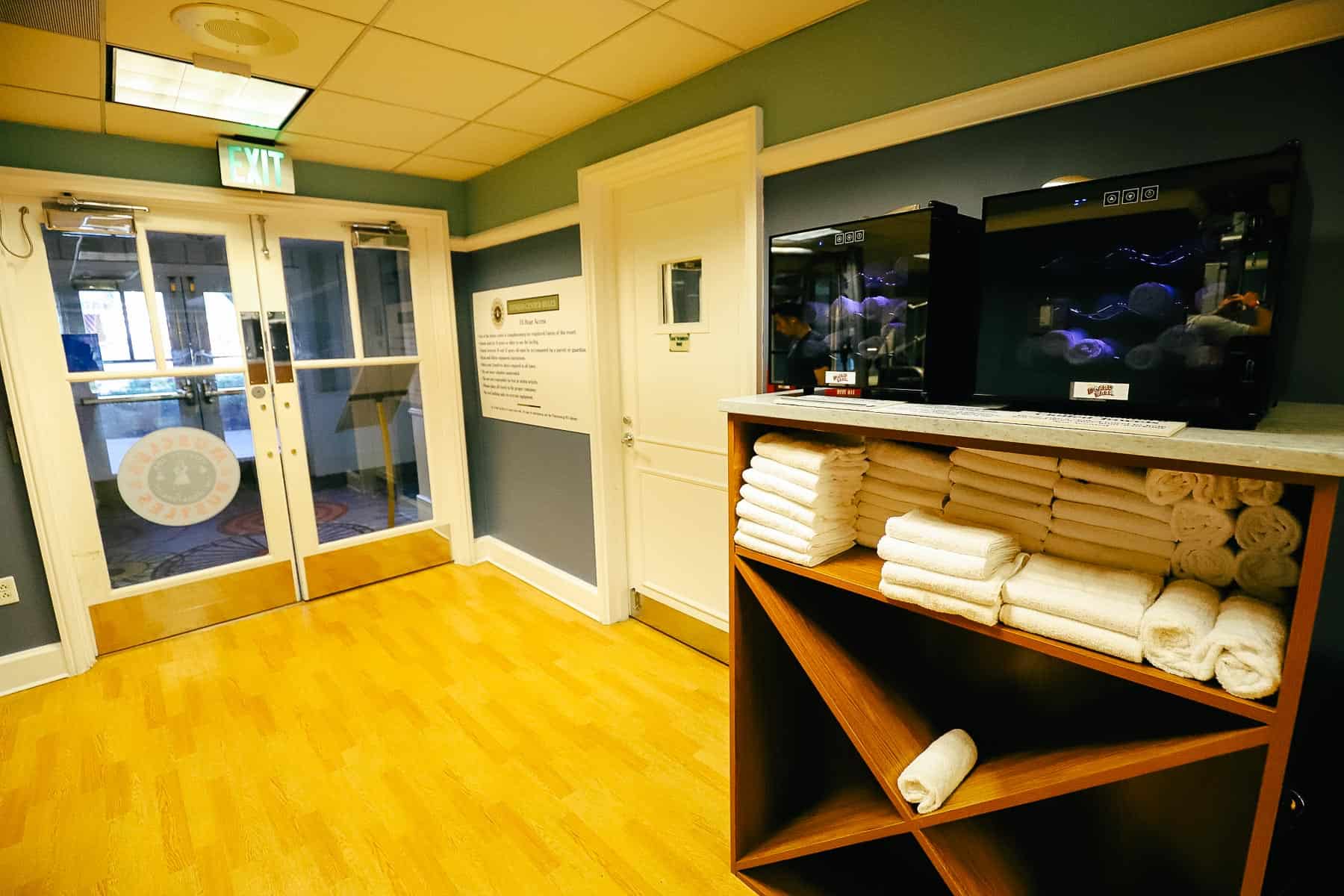 a stack of towels and warm and cold towels in a gym at Disney's Boardwalk 