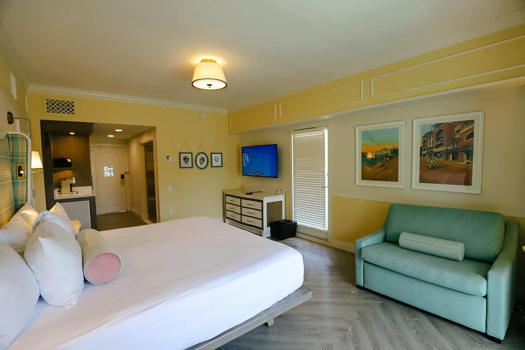 an angle of a king-size bed guest room at Disney's Boardwalk