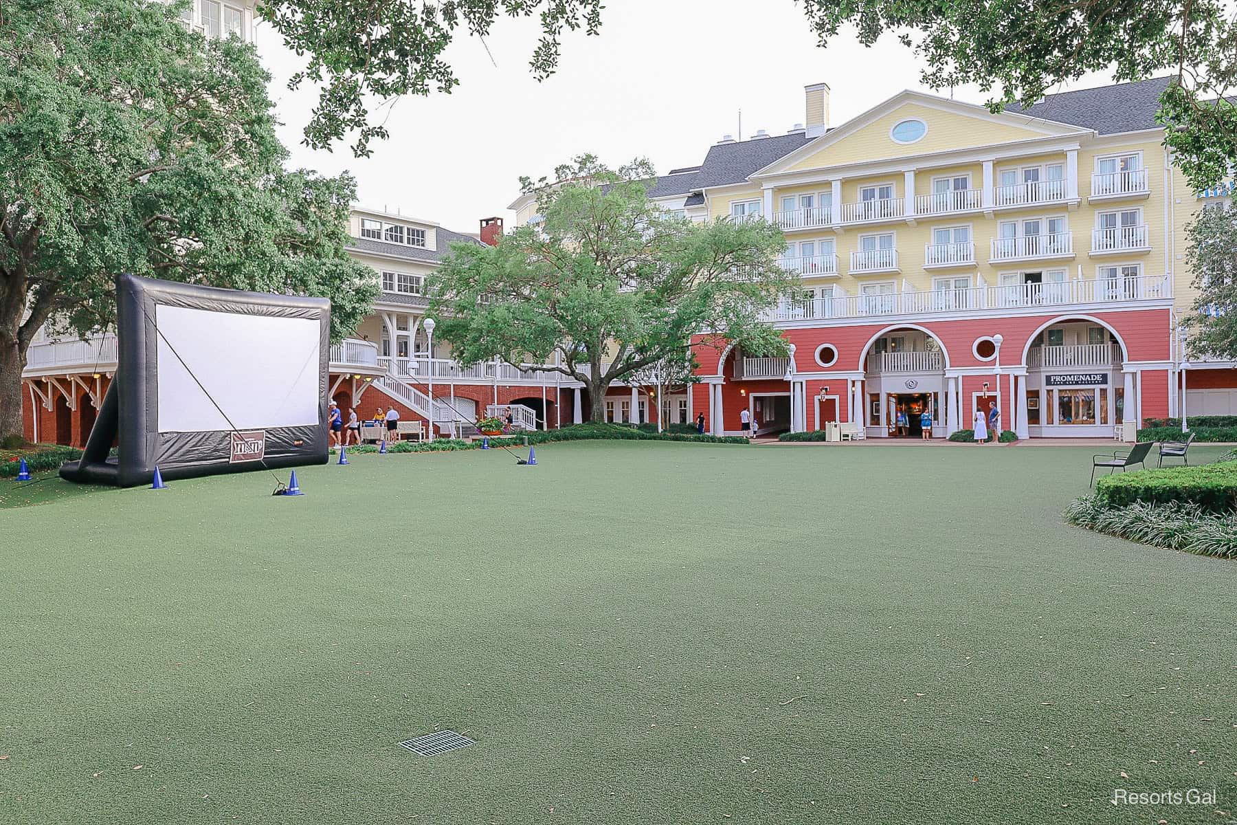 the Village Green with Movie Under the Stars setup at Disney's Boardwalk