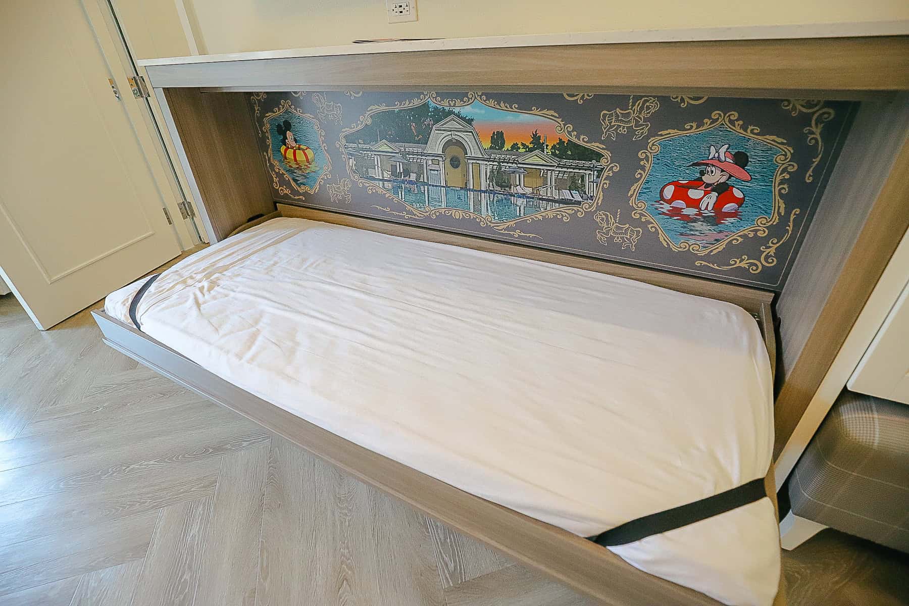 a pull down single bed with Mickey and Minnie artwork at the BoardWalk