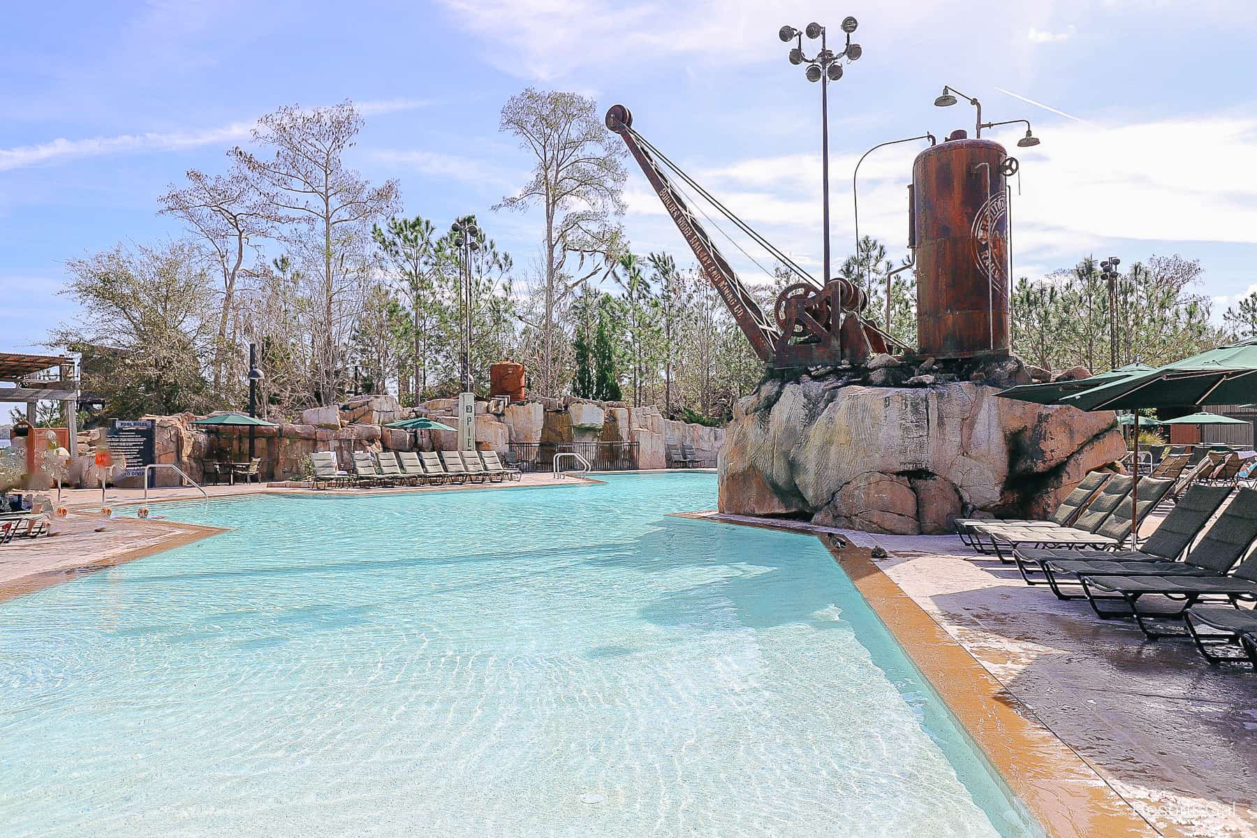 a crane extends over the pool as part of the theming 