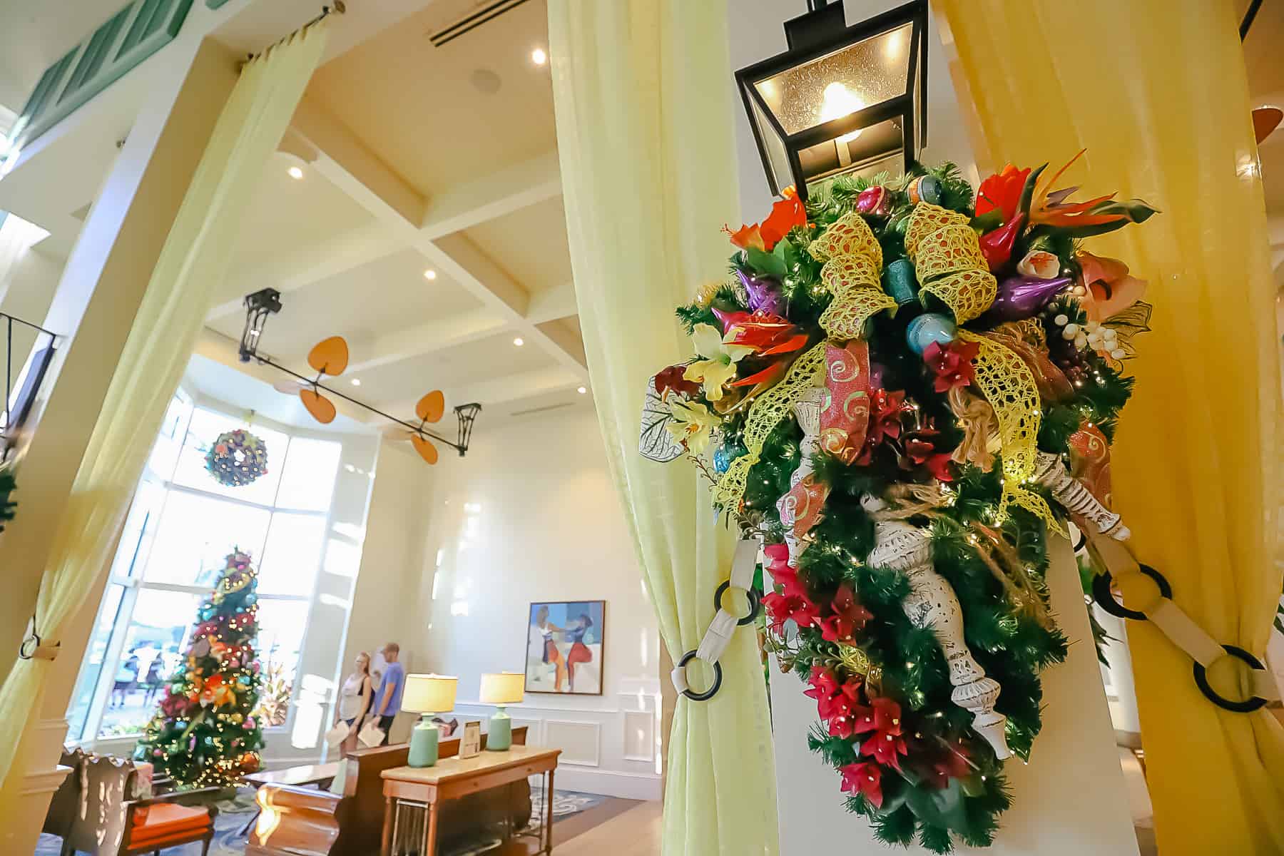 Christmas florals at Disney's Caribbean Beach hung around the light fixtures. 