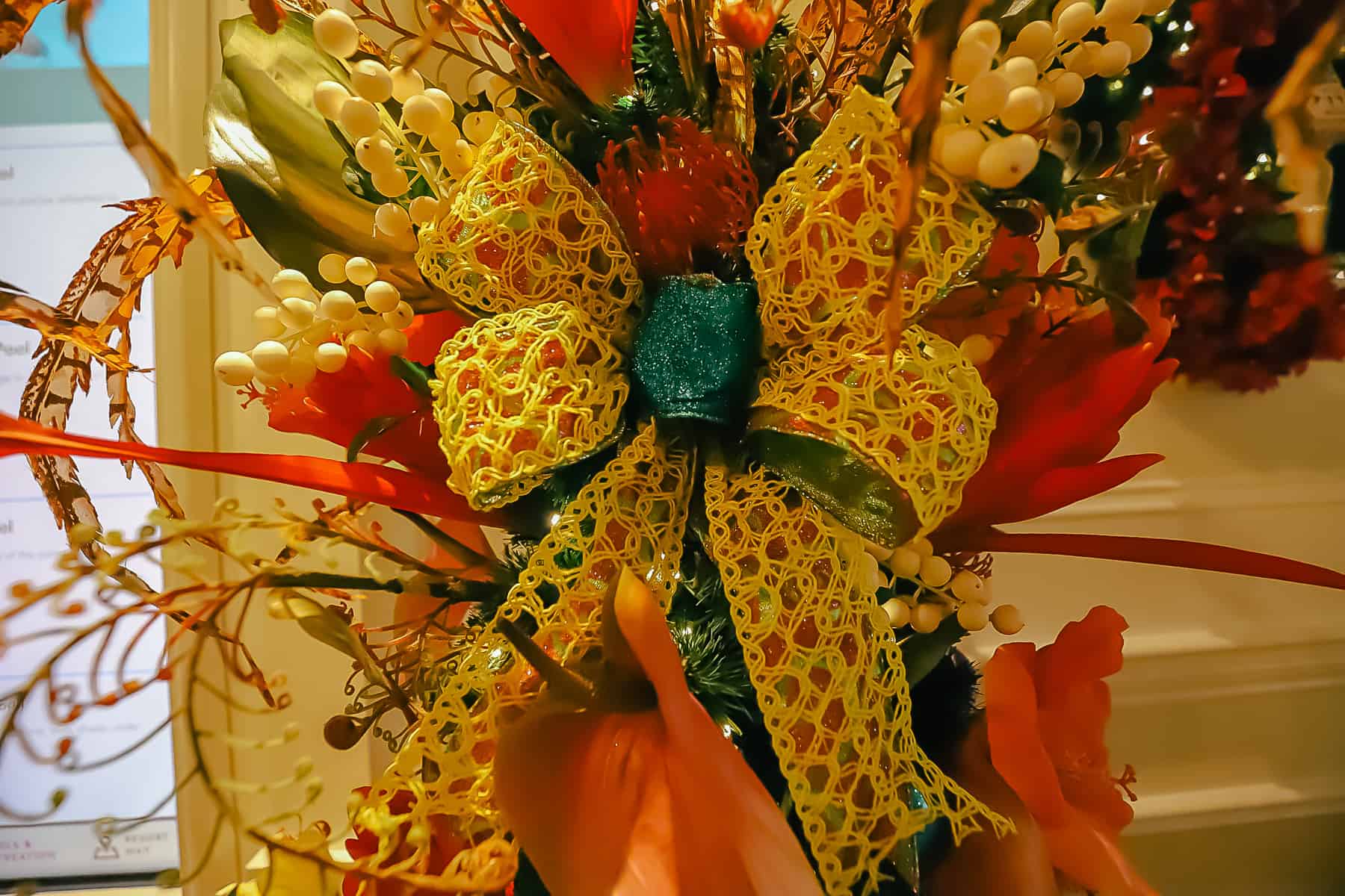 A close up of a knotted bow tied in the Christmas Tree. 