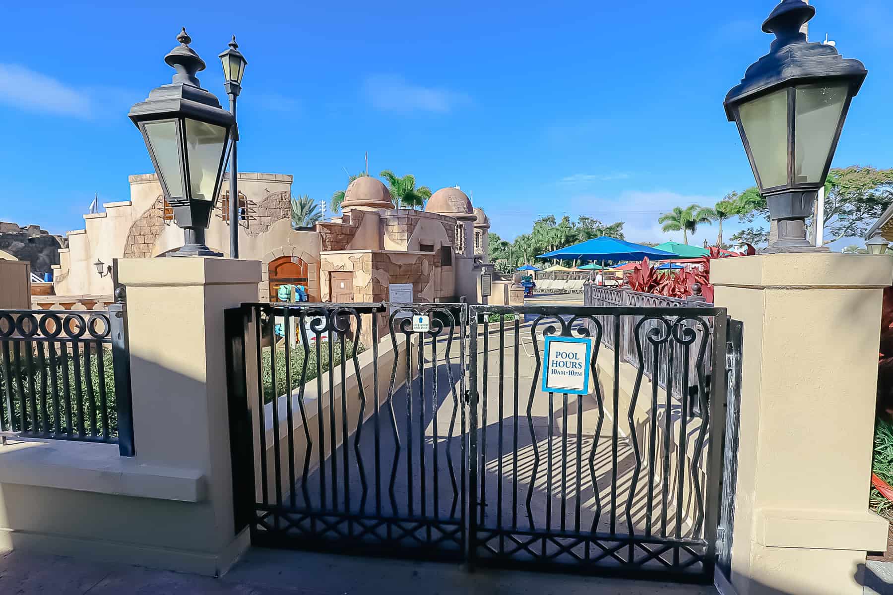 Feature pool hours are posted on the gate at Disney's Caribbean Beach as 10:00 a.m. until 10:00 p.m. 