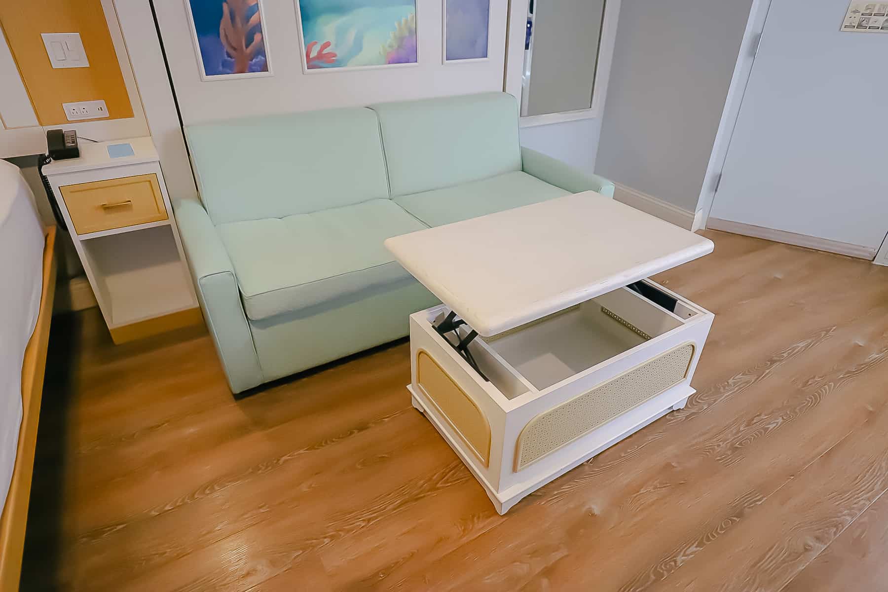 shows a table that lifts from the coffee table for dining or work