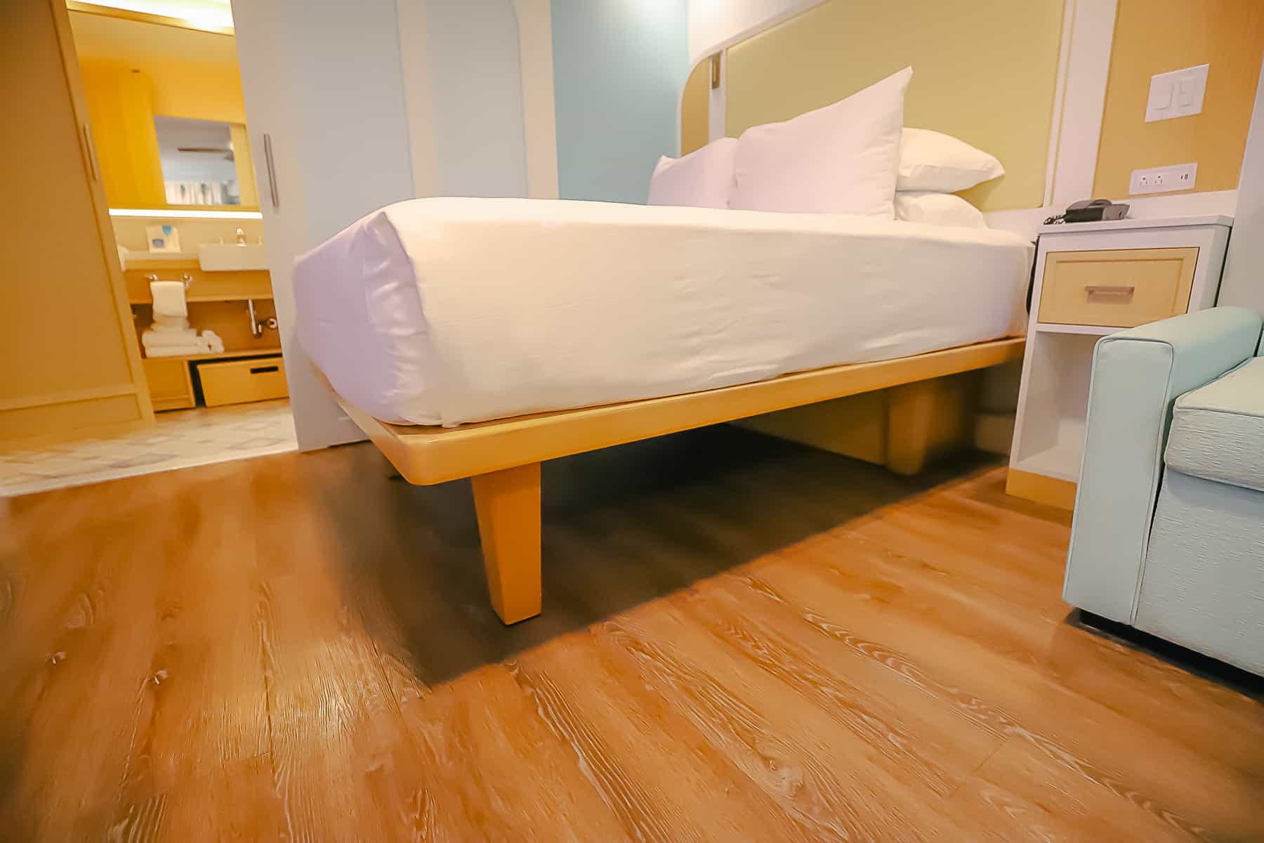 shows how you can store luggage underneath the platform bed in room