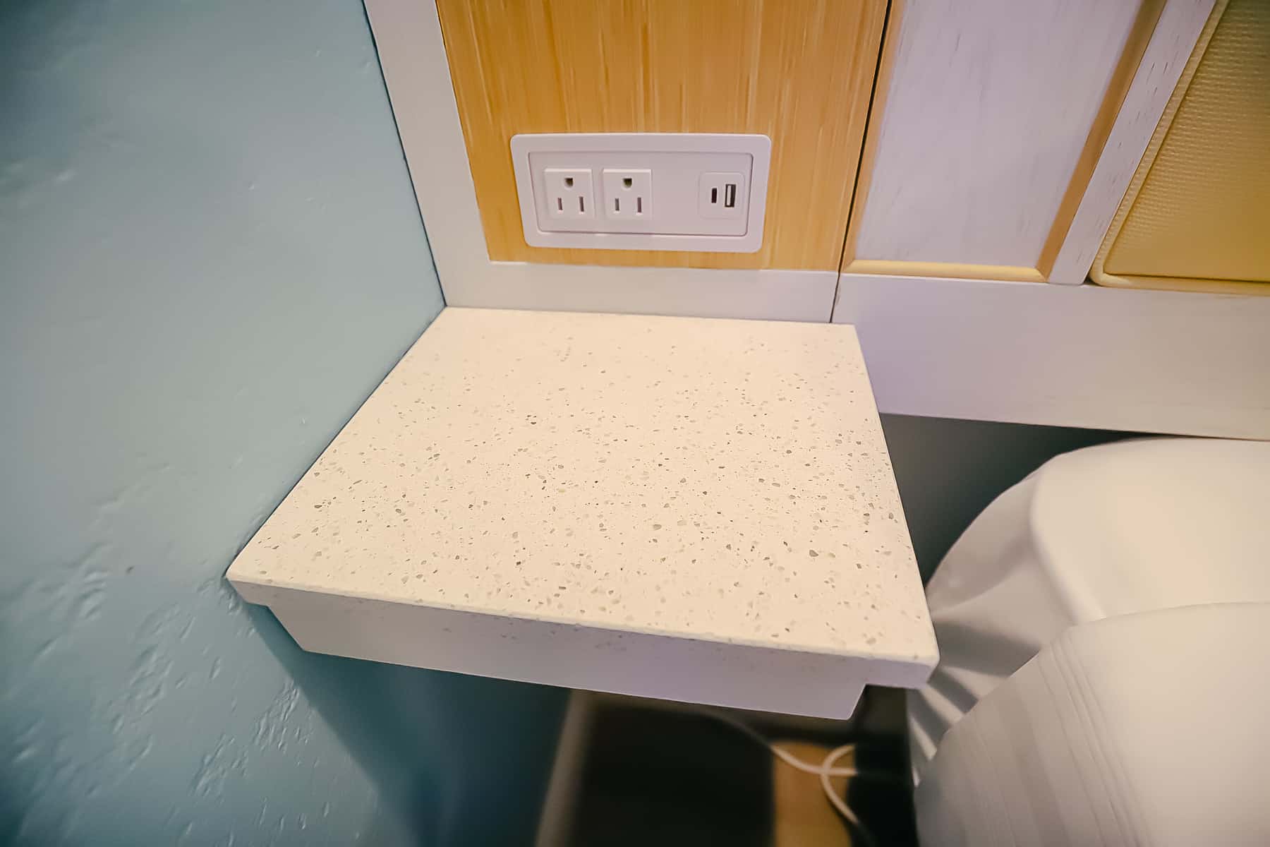 A small counter top built in to the wall on one side of the bed provides a place to charge your phone.