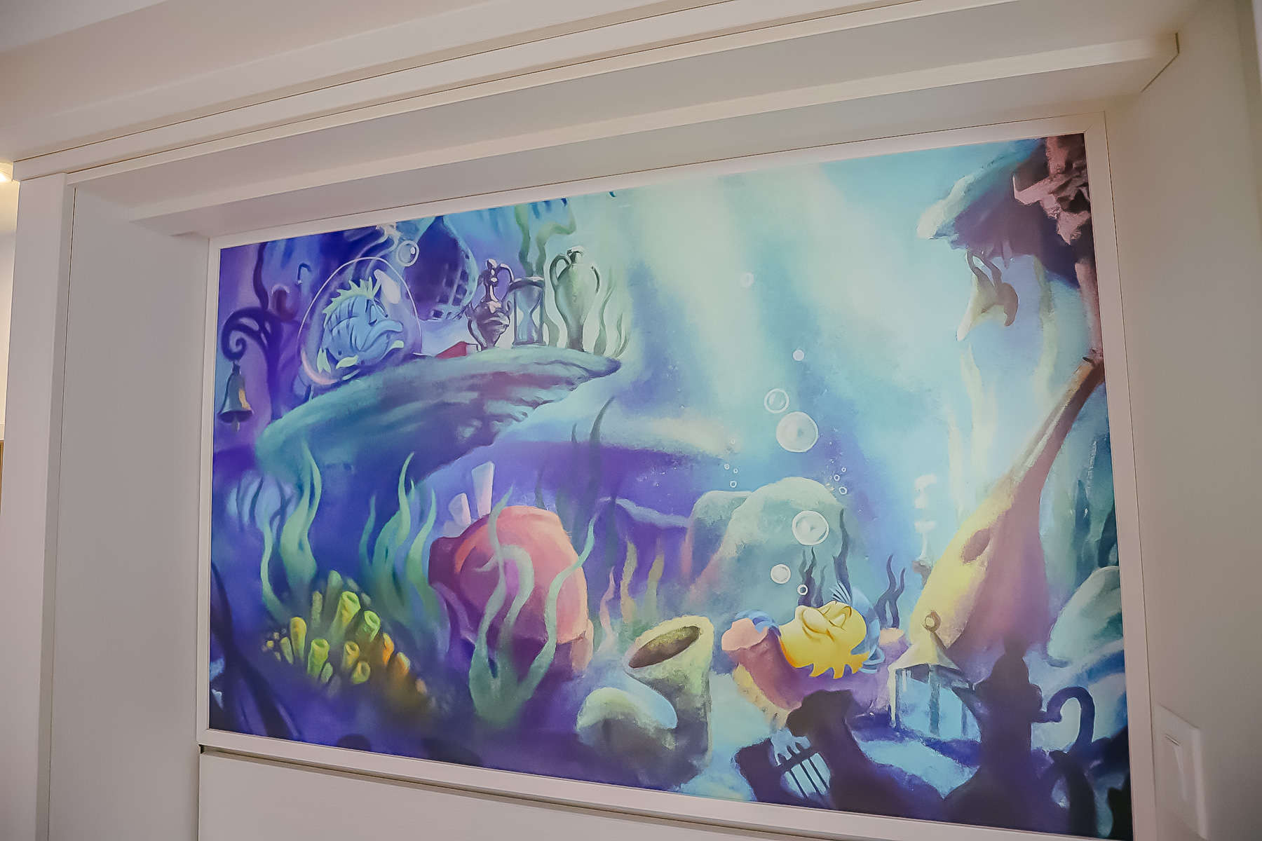 artwork behind Murphy bed featuring Flounder