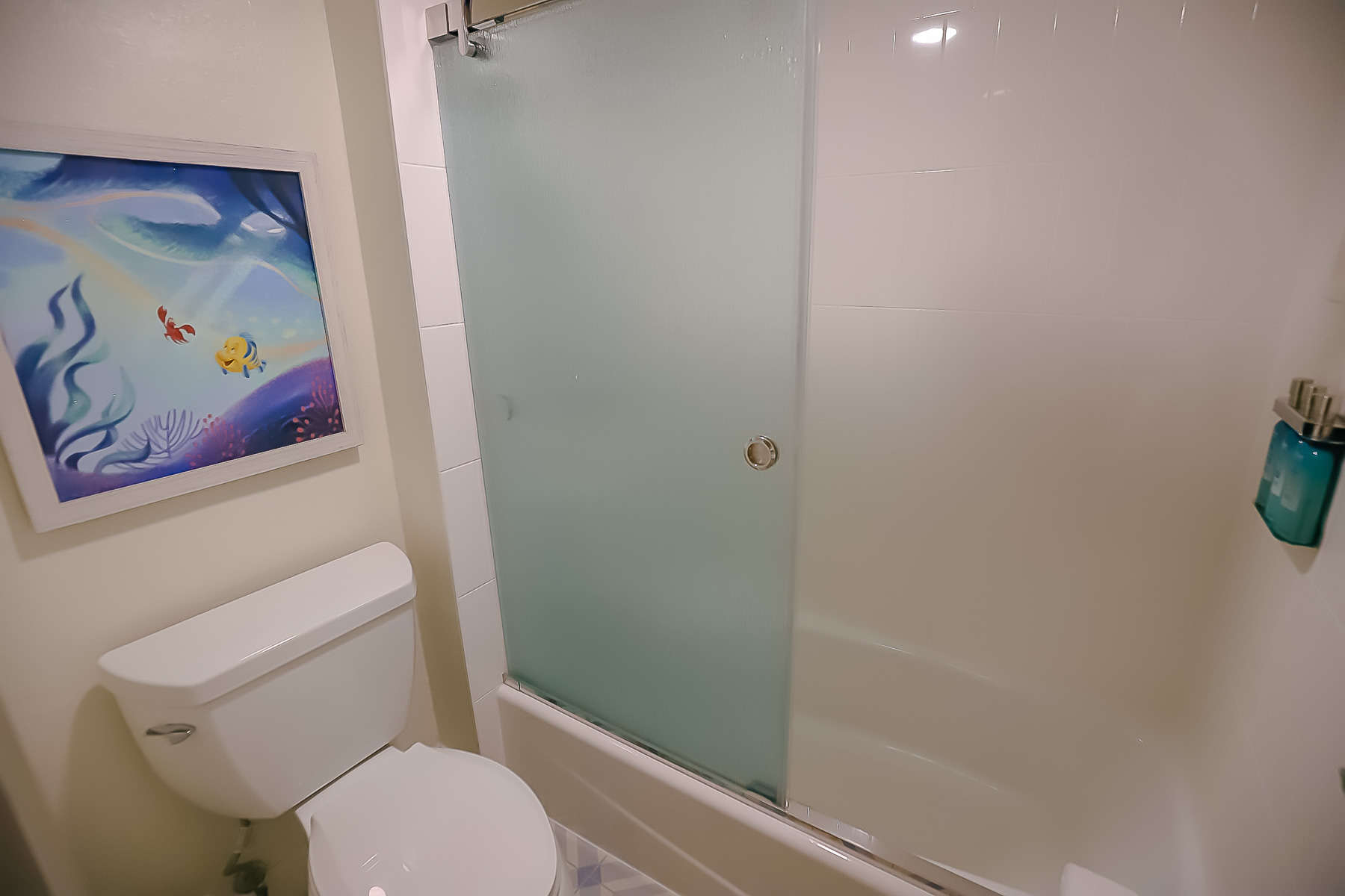 bath tub with a shower combination in 'The Little Mermaid Rooms' at Caribbean Beach