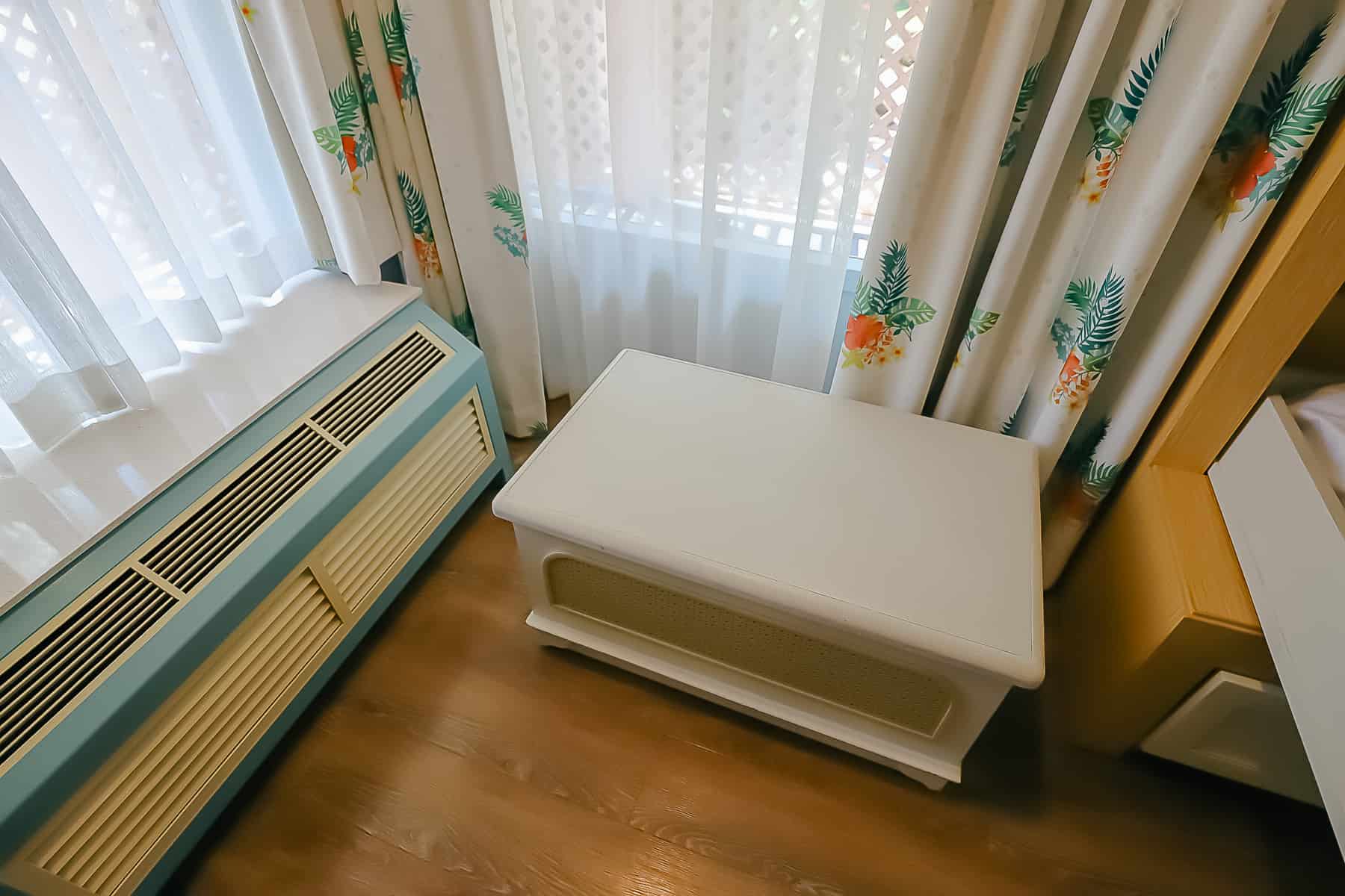 Coffee table rolled to the corner of the room to make room for the pull-down bed. 