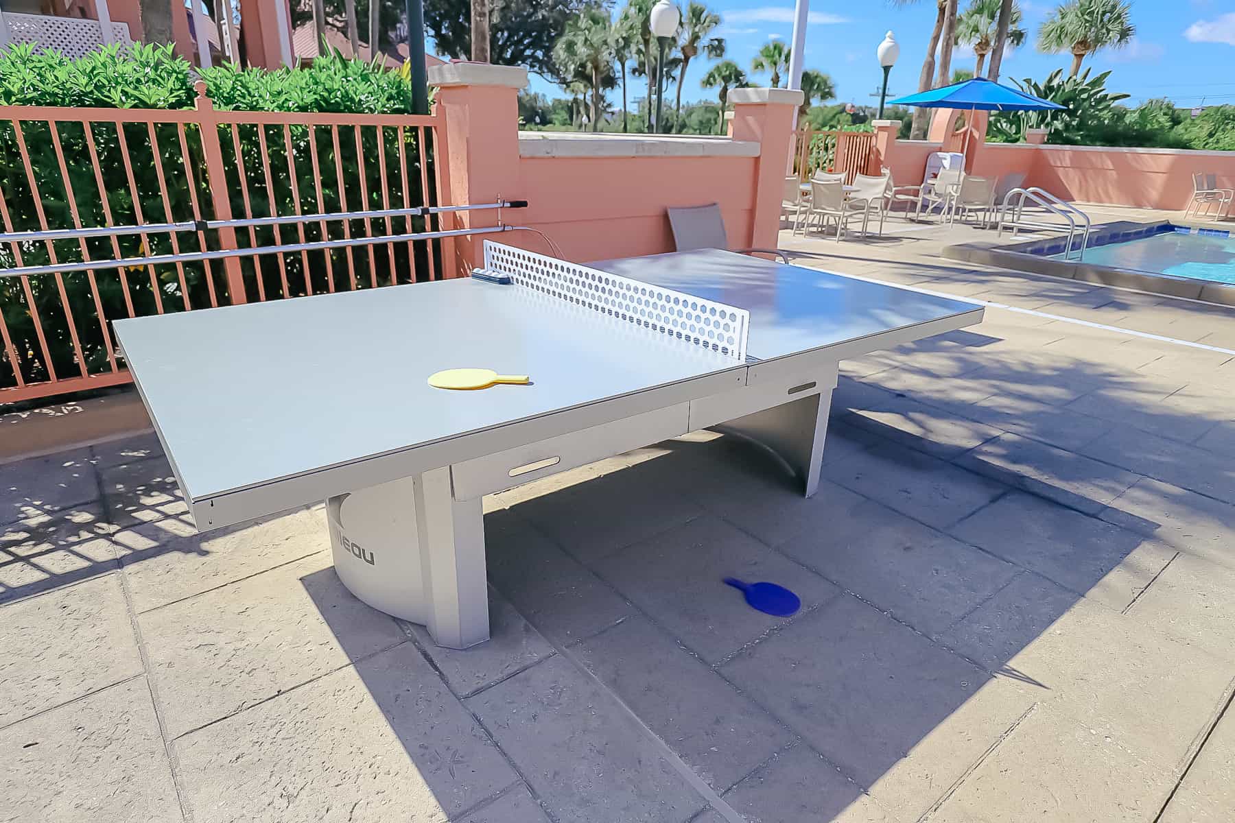 ping pong table game by the pool