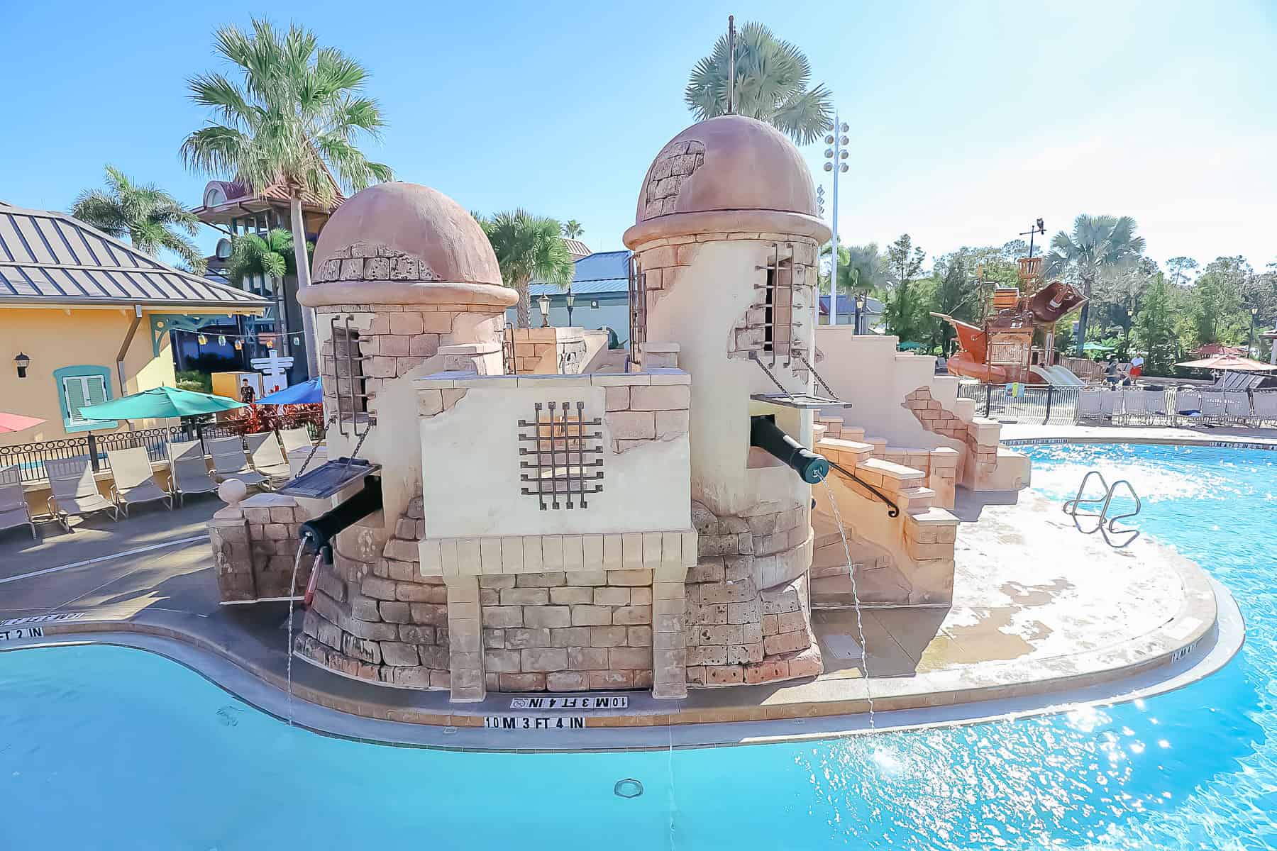 pool is themed to look like a Spanish fortress