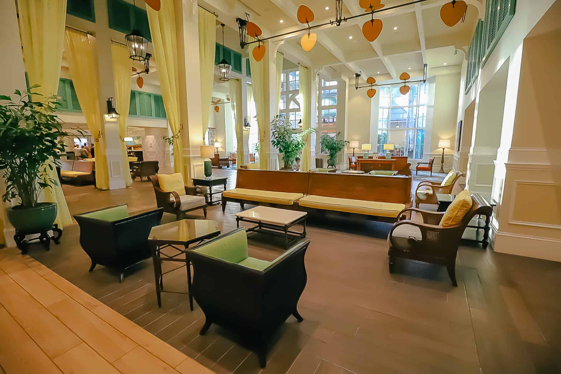 the lobby at Disney's Caribbean Beach with multiple seating arrangements 