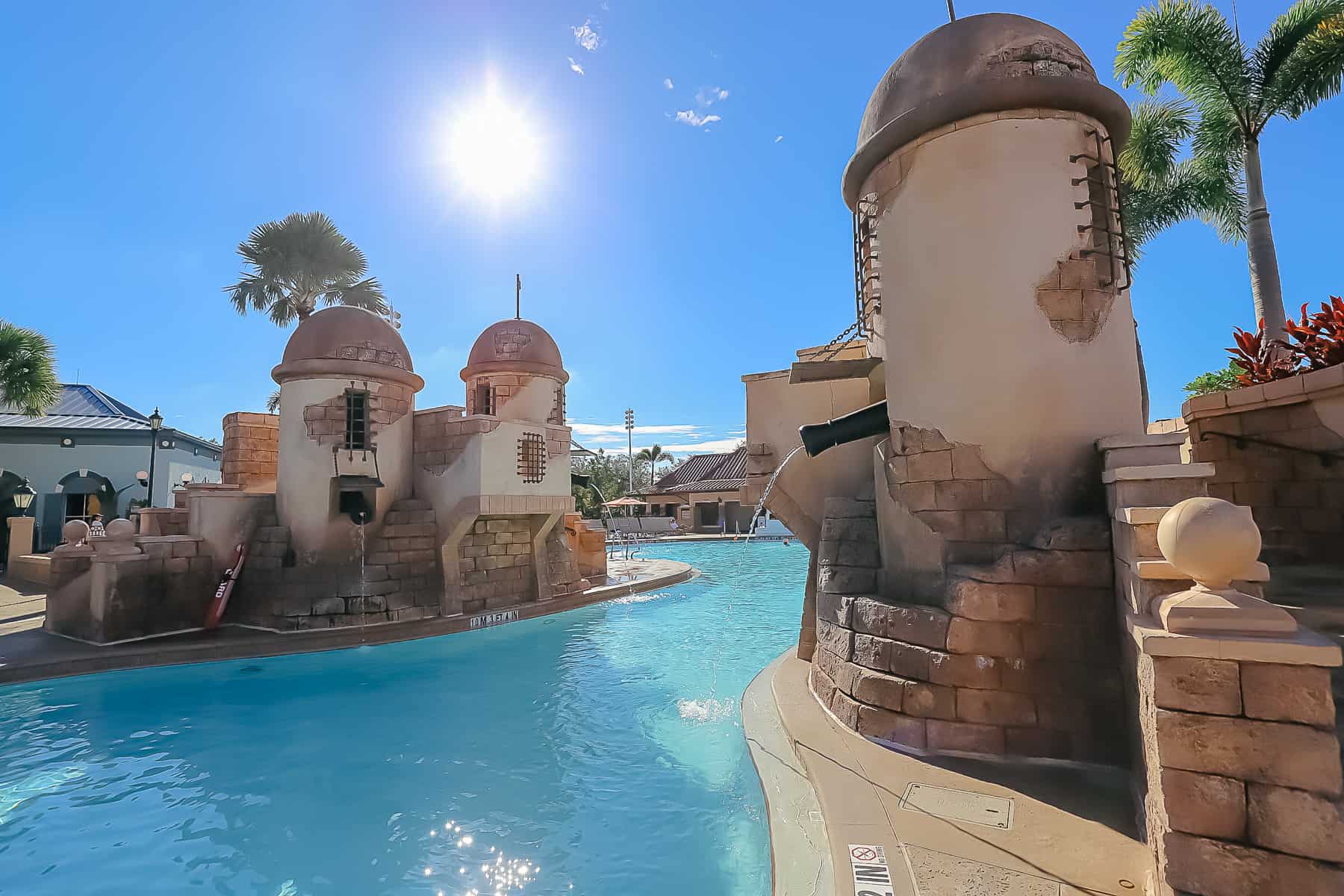 The Fuentes del Morro pool at Disney's Caribbean Beach showing Spanish fortress theming. 