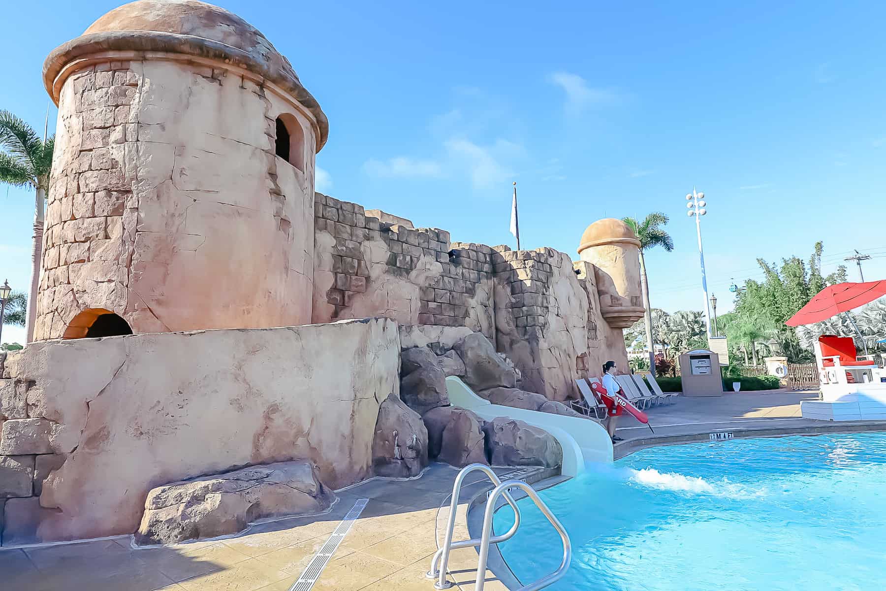 shows the waterslide exiting into the pool