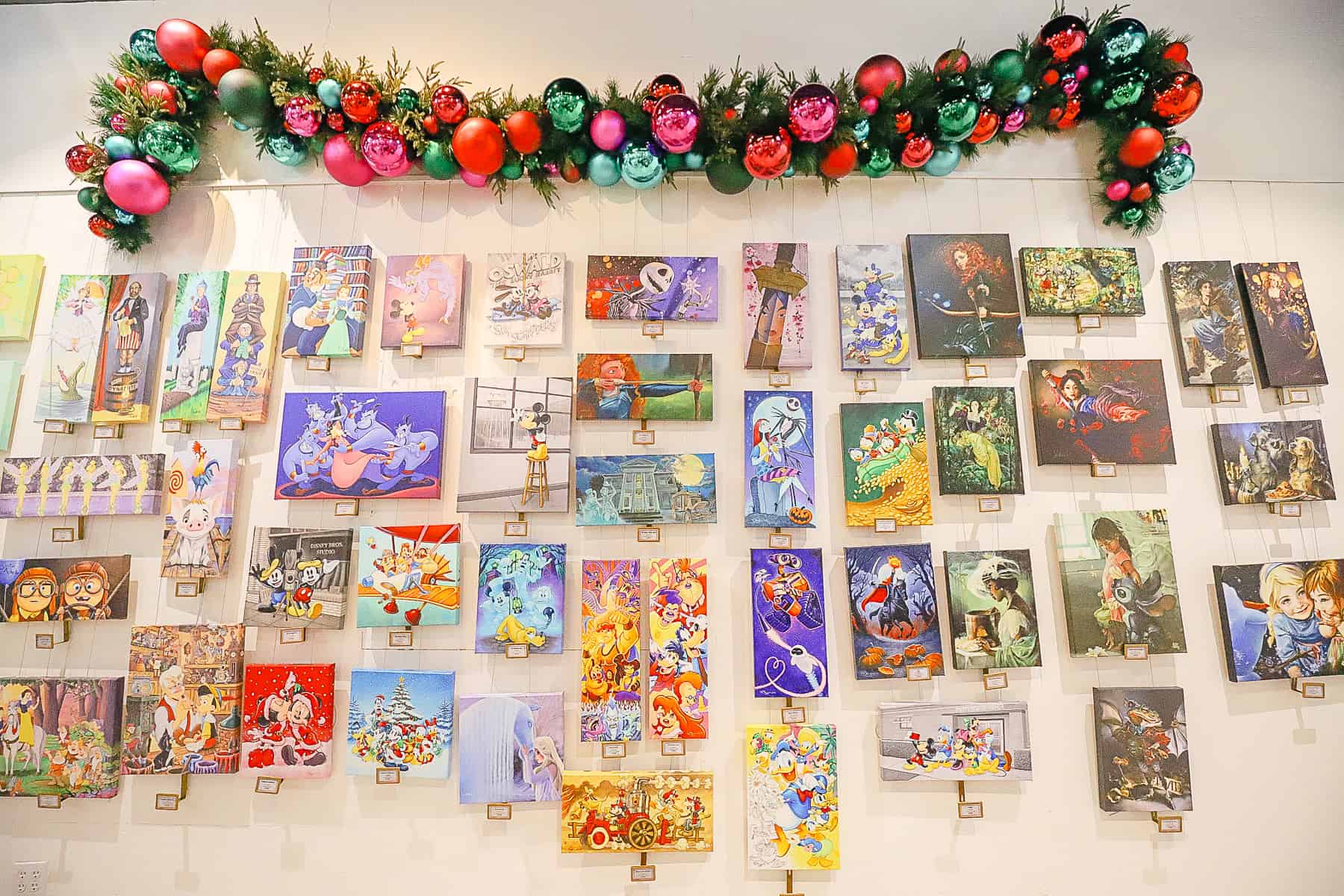 a display with many unique pieces of artwork for sale