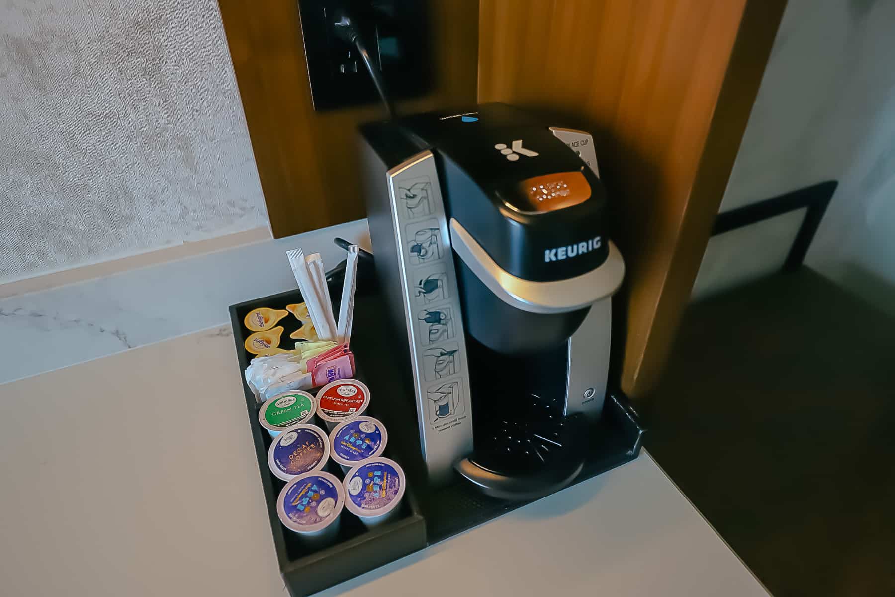 A Keurig coffee maker and accompaniments provided in rooms at Gran Destino Tower. 