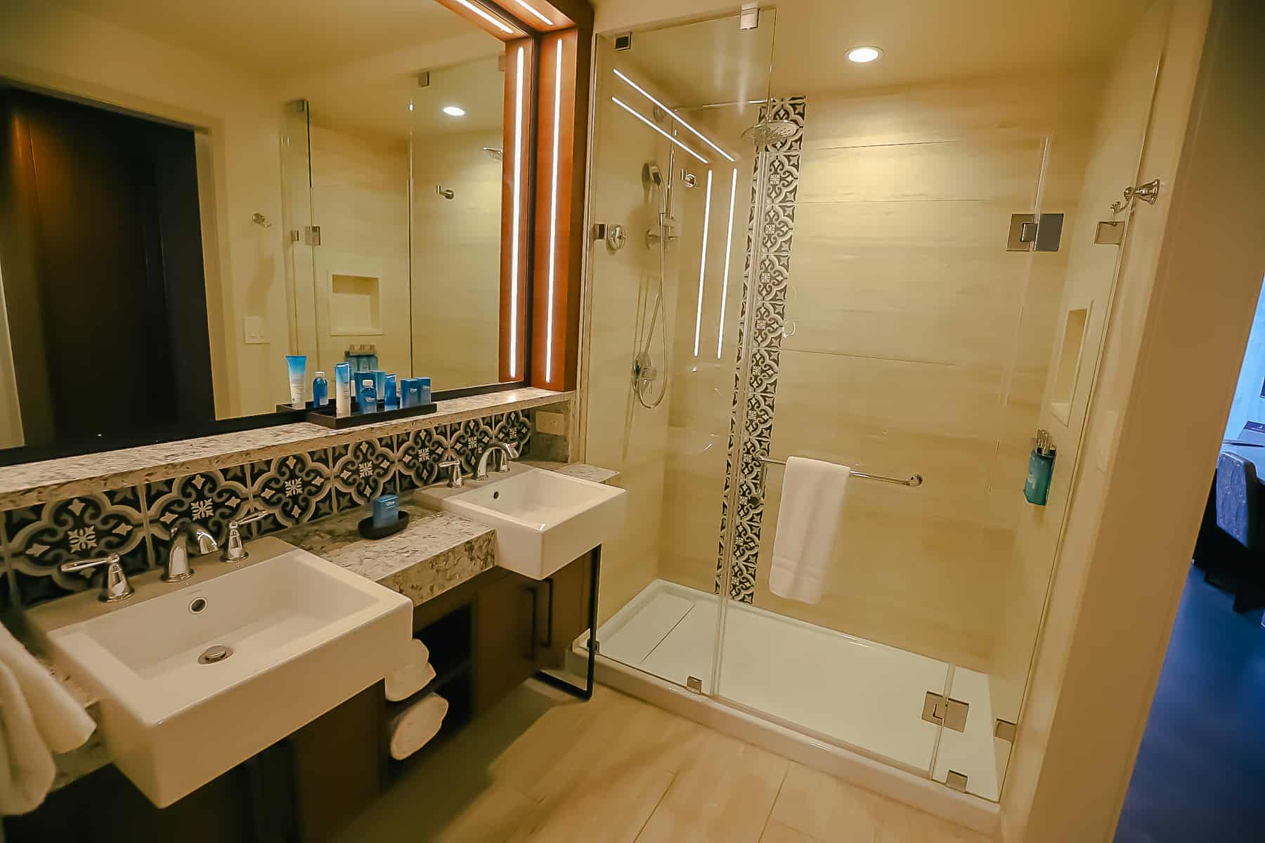 shows the walk-in shower in room at Gran Destino Tower 