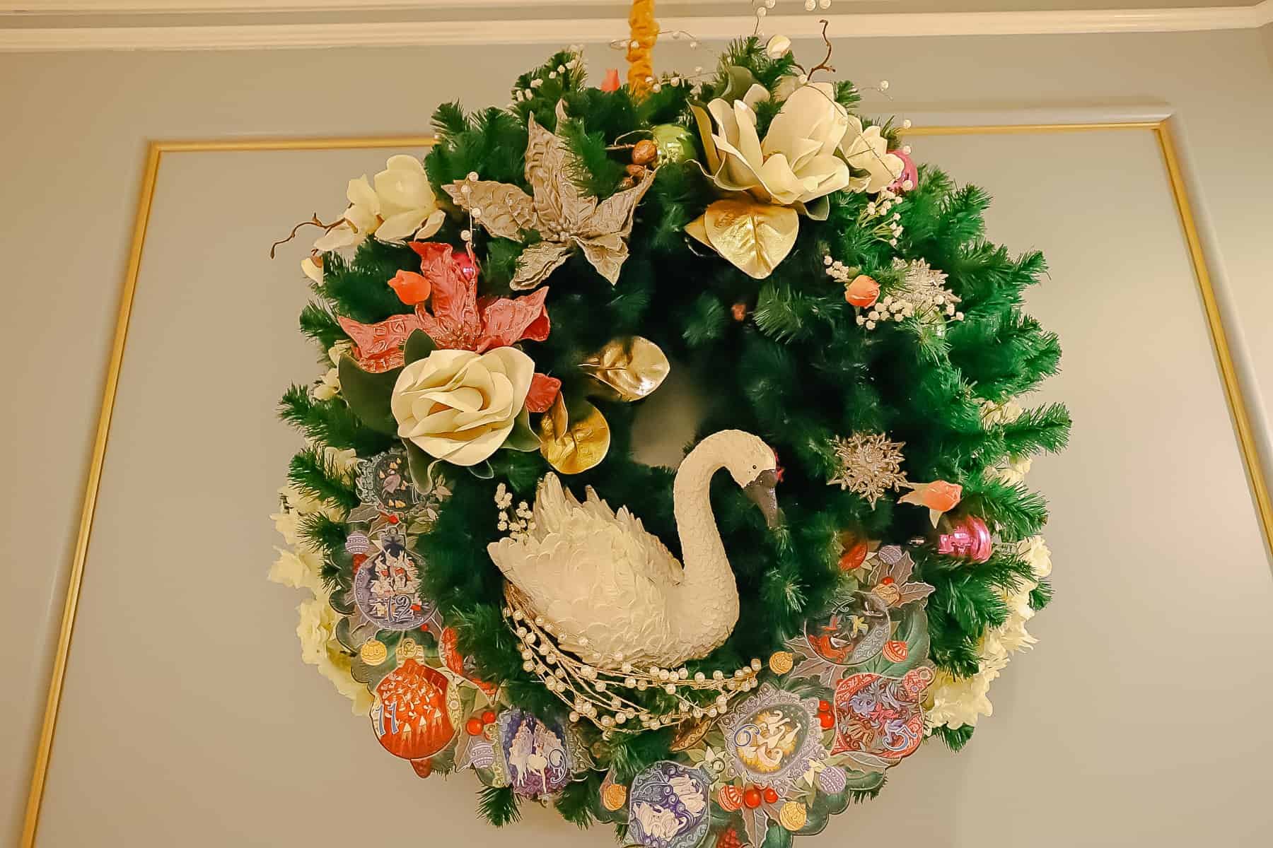 A holiday wreath at Grand Floridian with a swan in the center of it. 