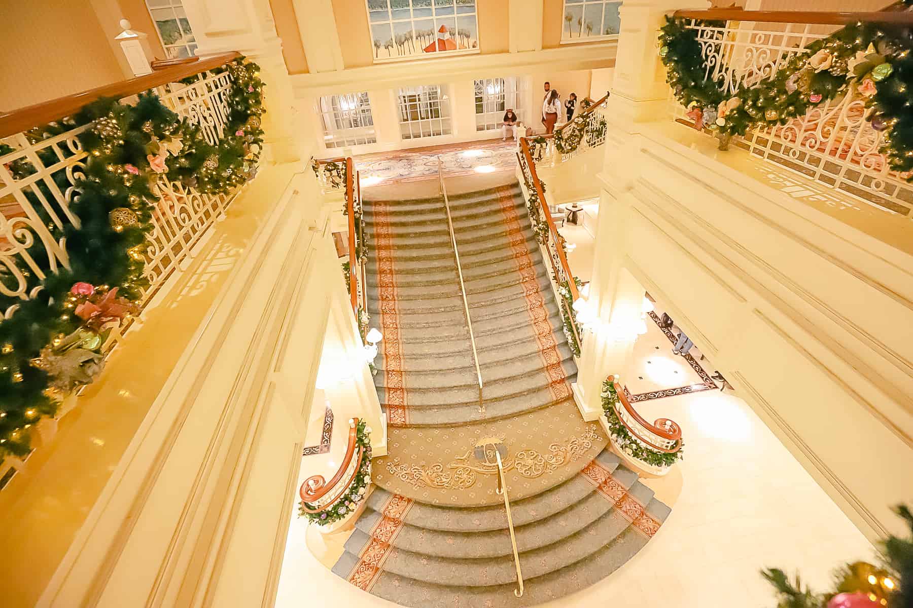 A view from above the Grand Floridian's staircase with its Christmas decor. 