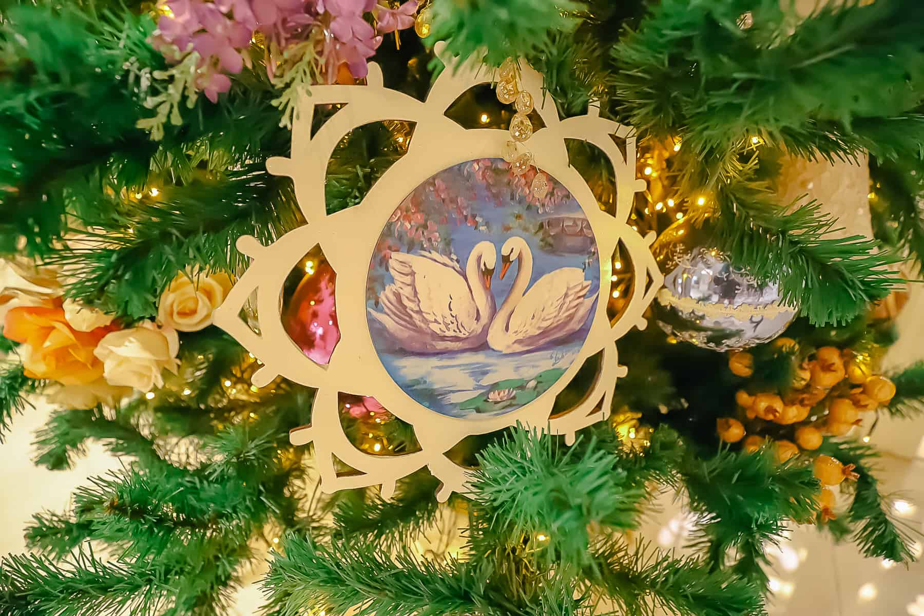 a cutout ornament with swans