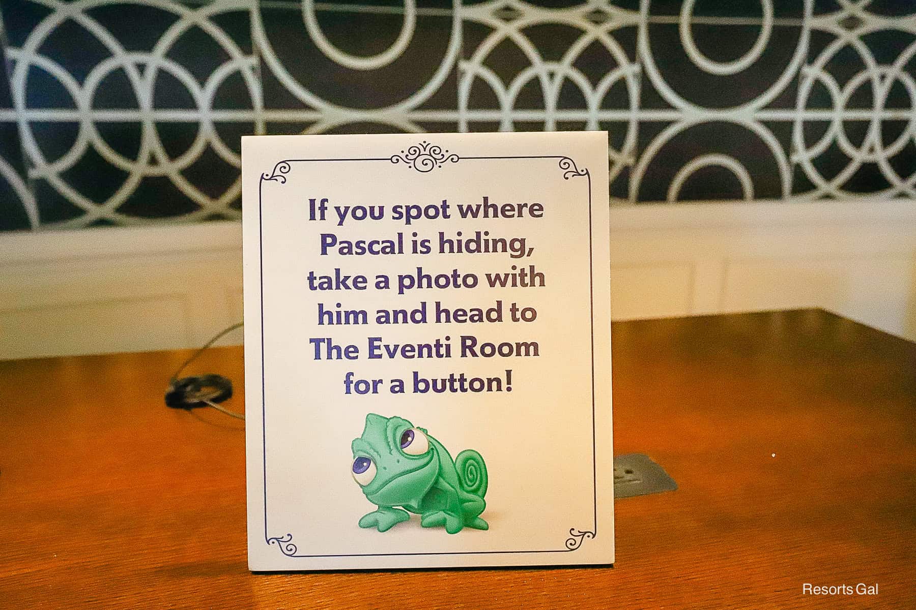 a sign that reads, "If you spot Pascal, take a photo with him and head to the Eventi Room for a Surprise