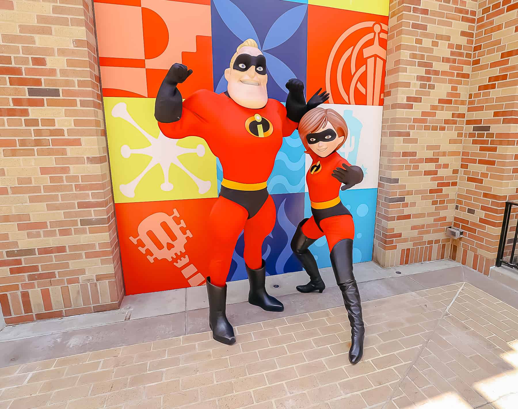 Mr.s and Mrs. Incredible posing like super heroes. 