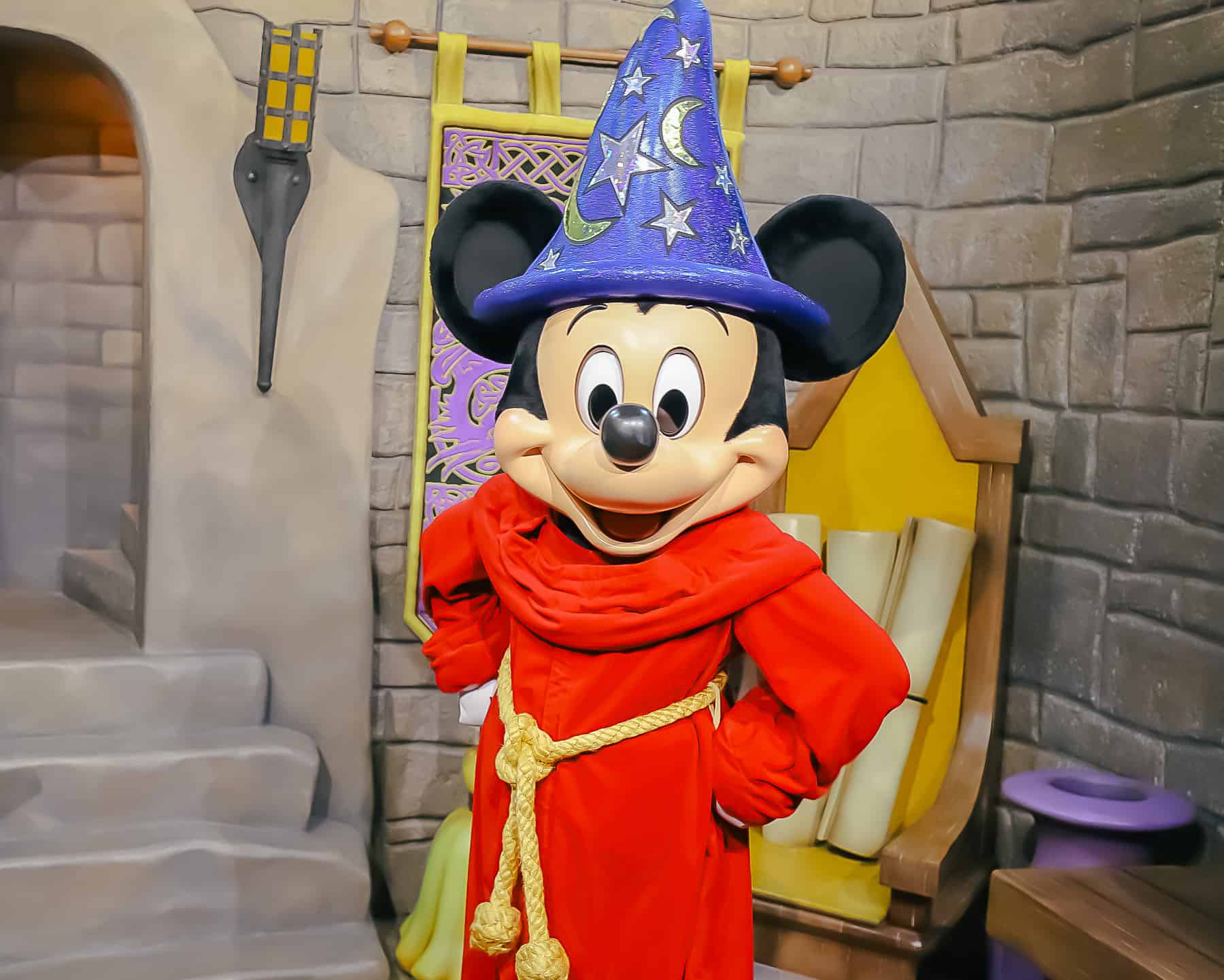 Sorcerer Mickey with his hands on his hips. 