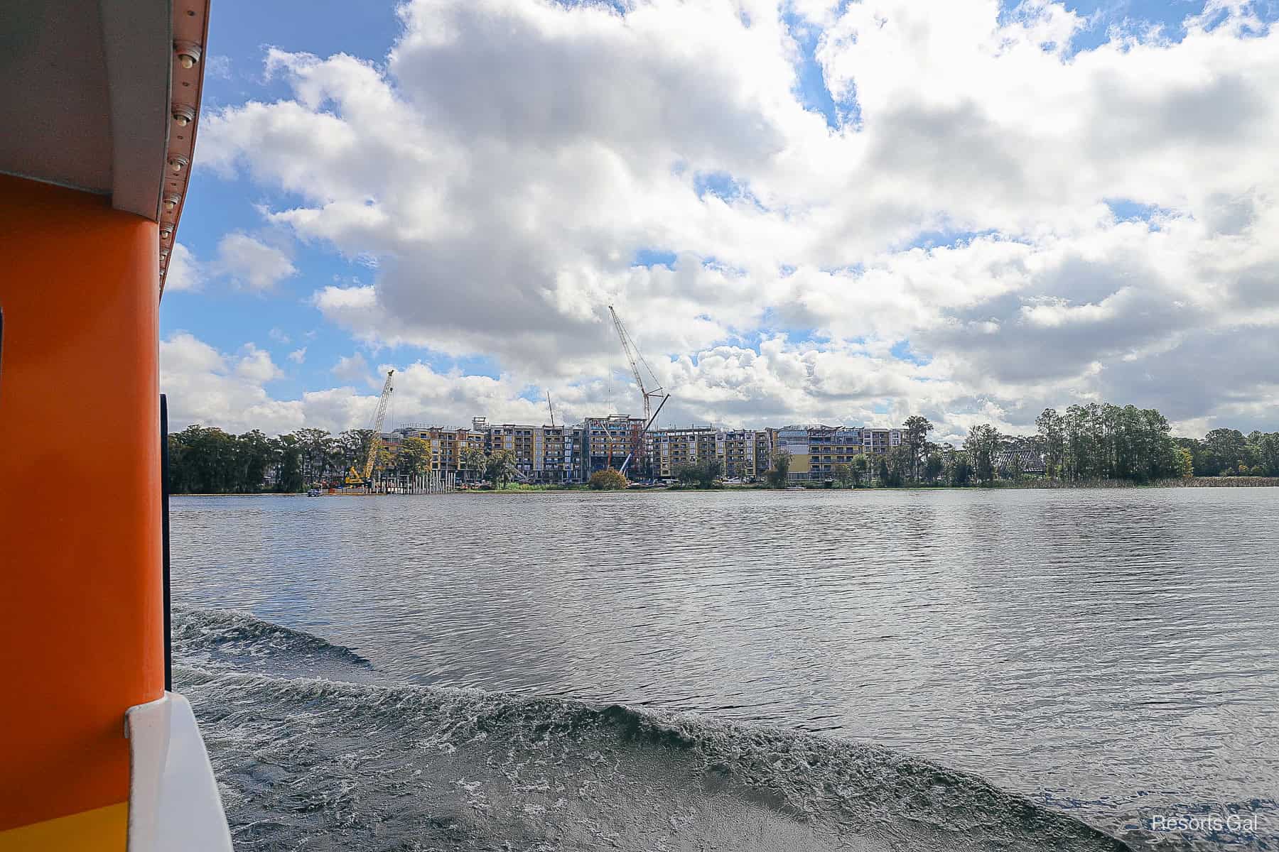 a view from the side of the boat facing Lakeshore Lodge