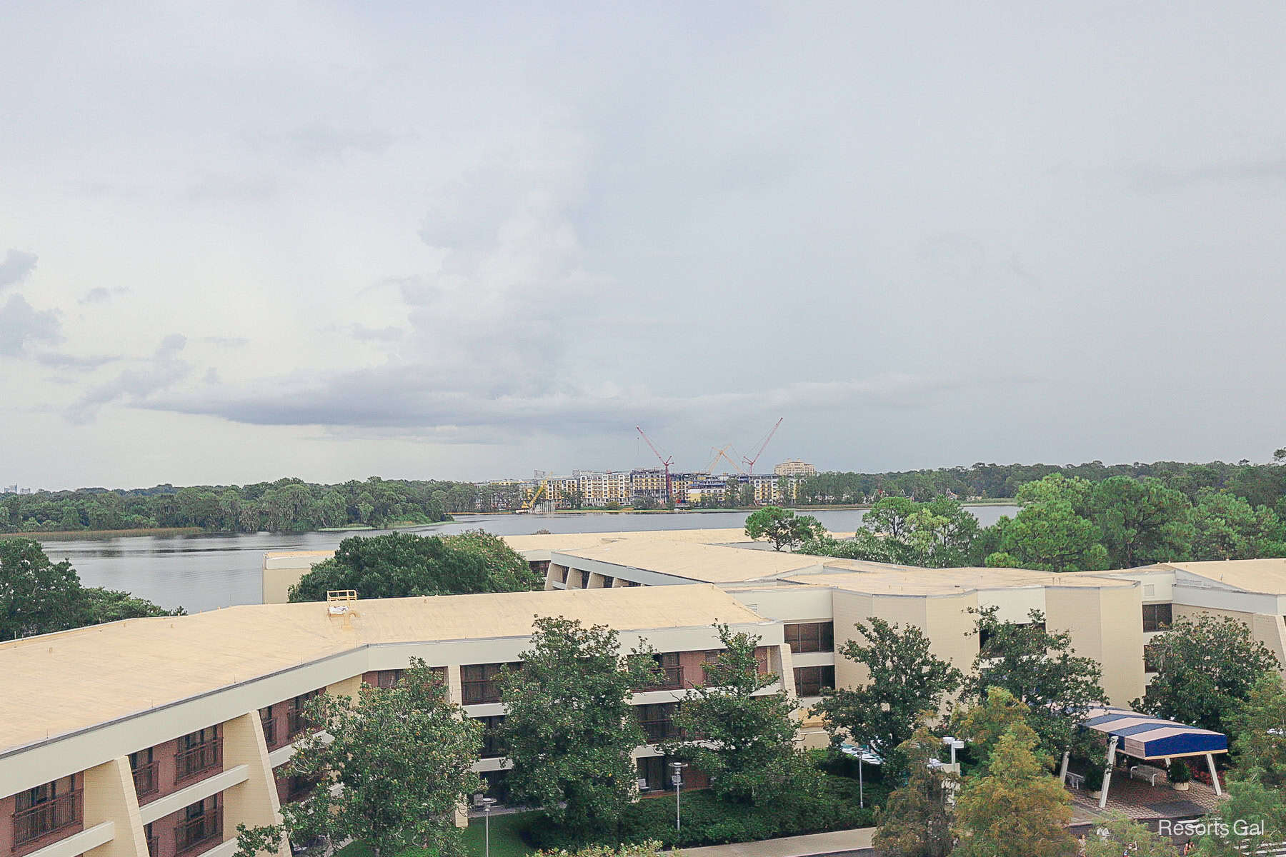 a view of Lakeshore Lodge sitting beyond the Garden Wing at Disney's Contemporary Resort.