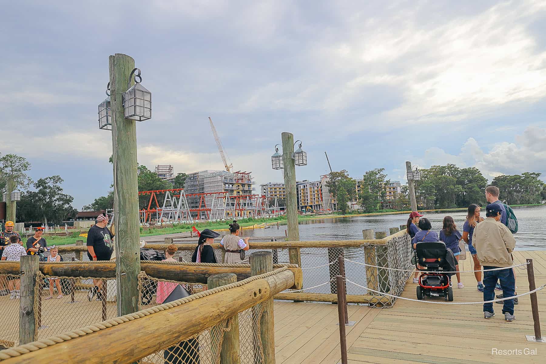 guests waiting on a boat with a view of Lakeshore Lodge