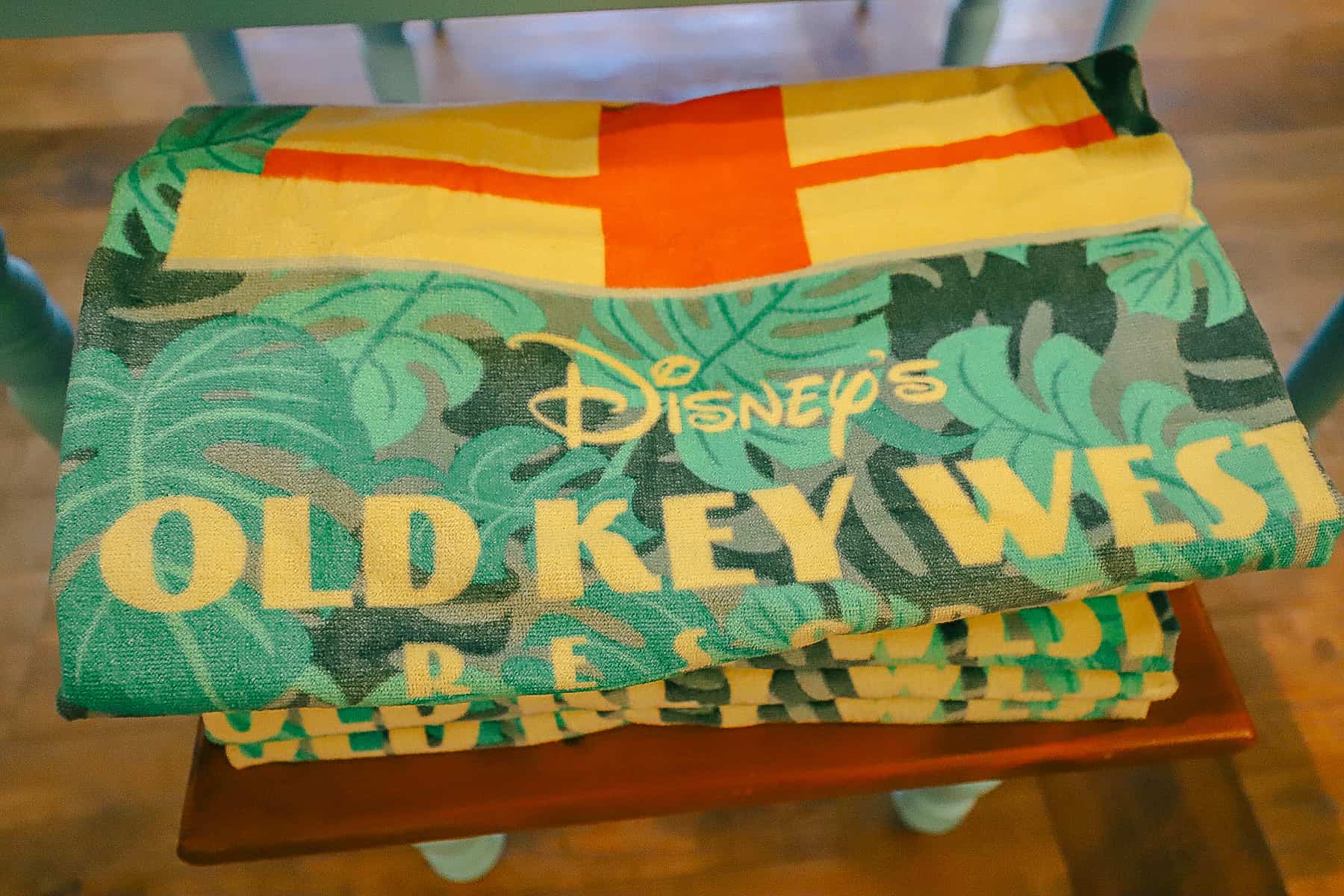 folded beach towel that says Disney's Old Key West 