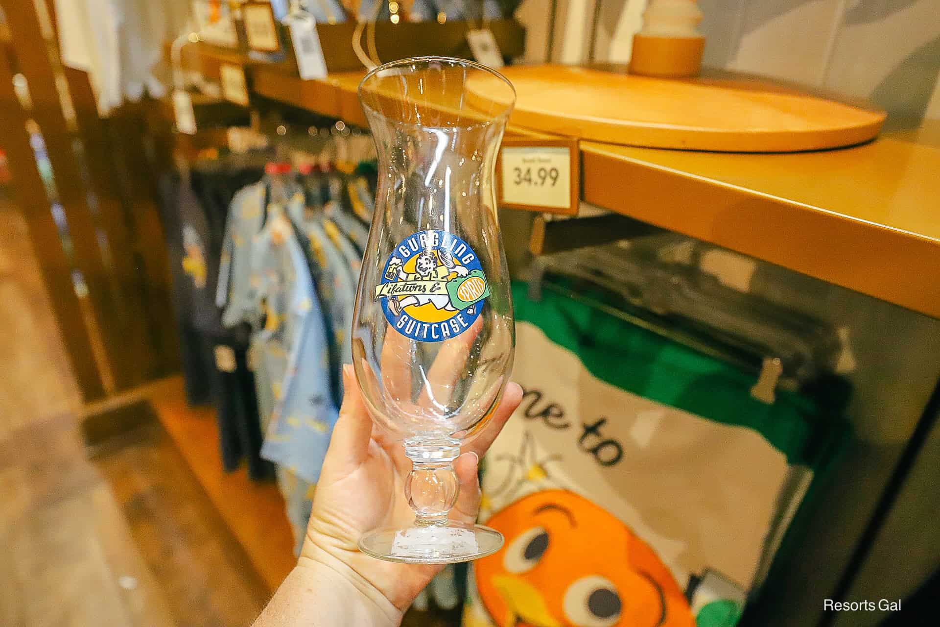 a hurricane glass with the Gurgling suitcase logo