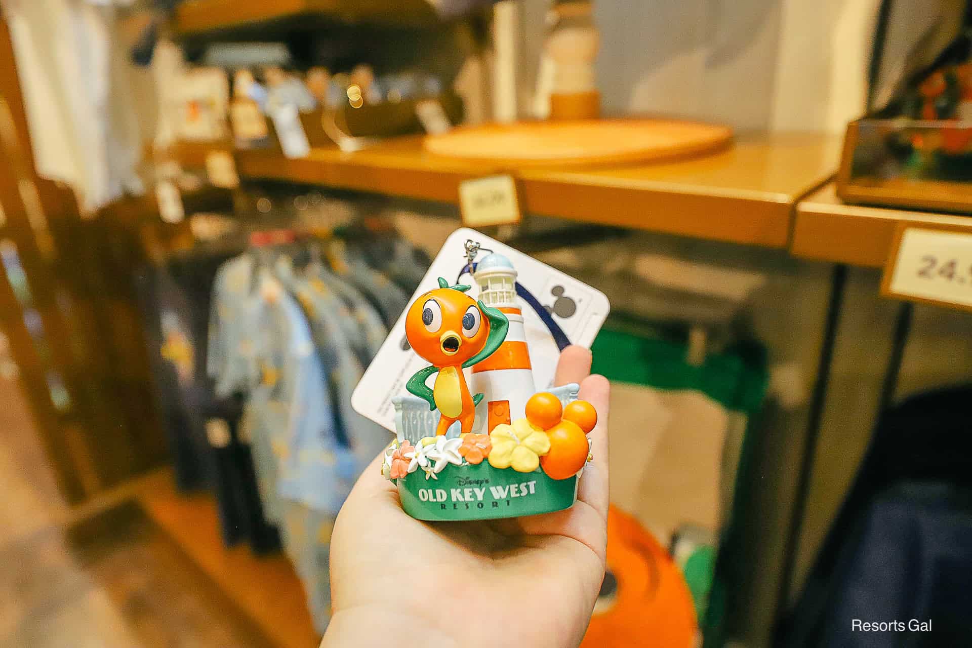 an Orange Bird and Lighthouse ornament representing Disney's Old Key West