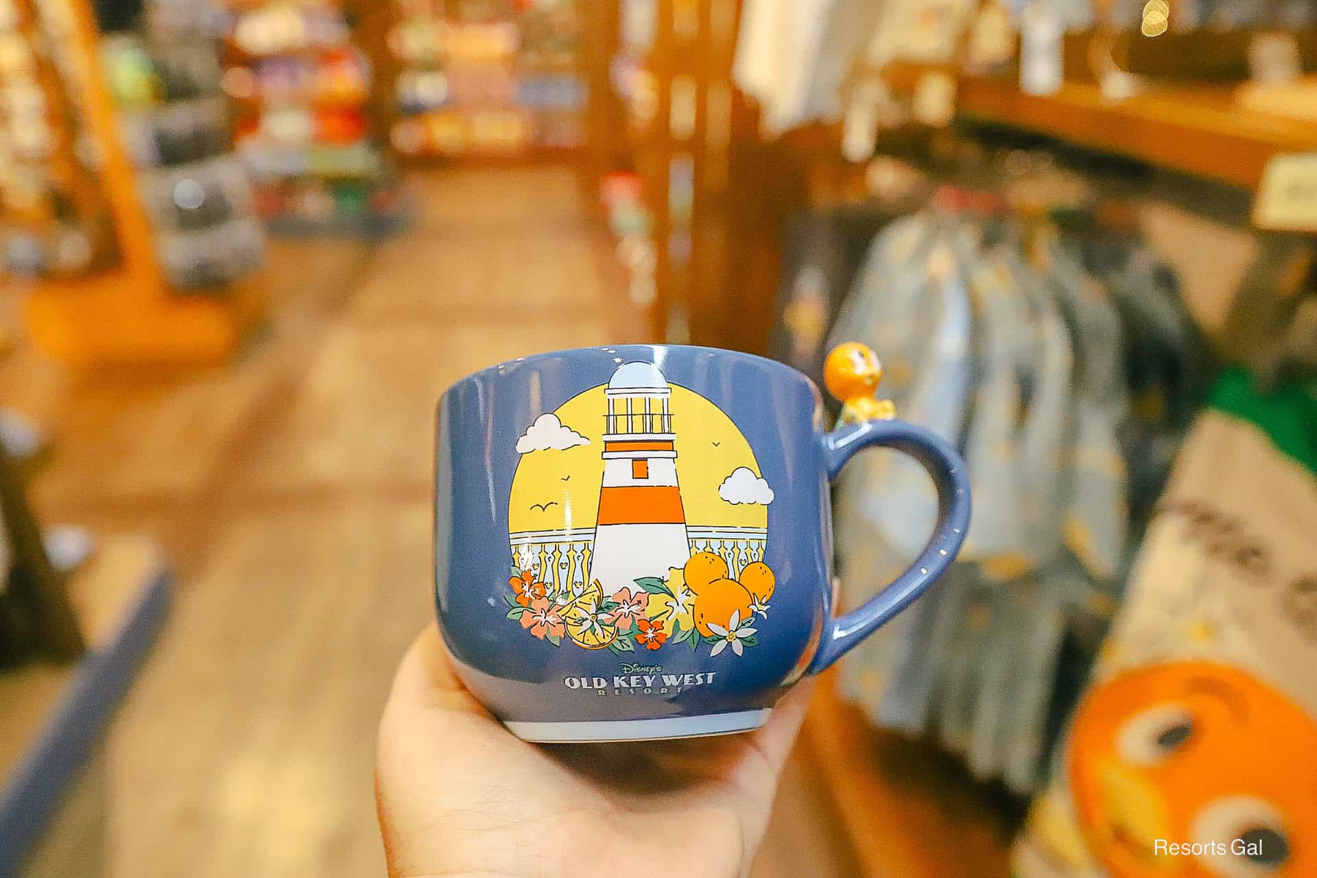 resort mug for Old Key West with Lighthouse and a mini Orange Bird on the handle