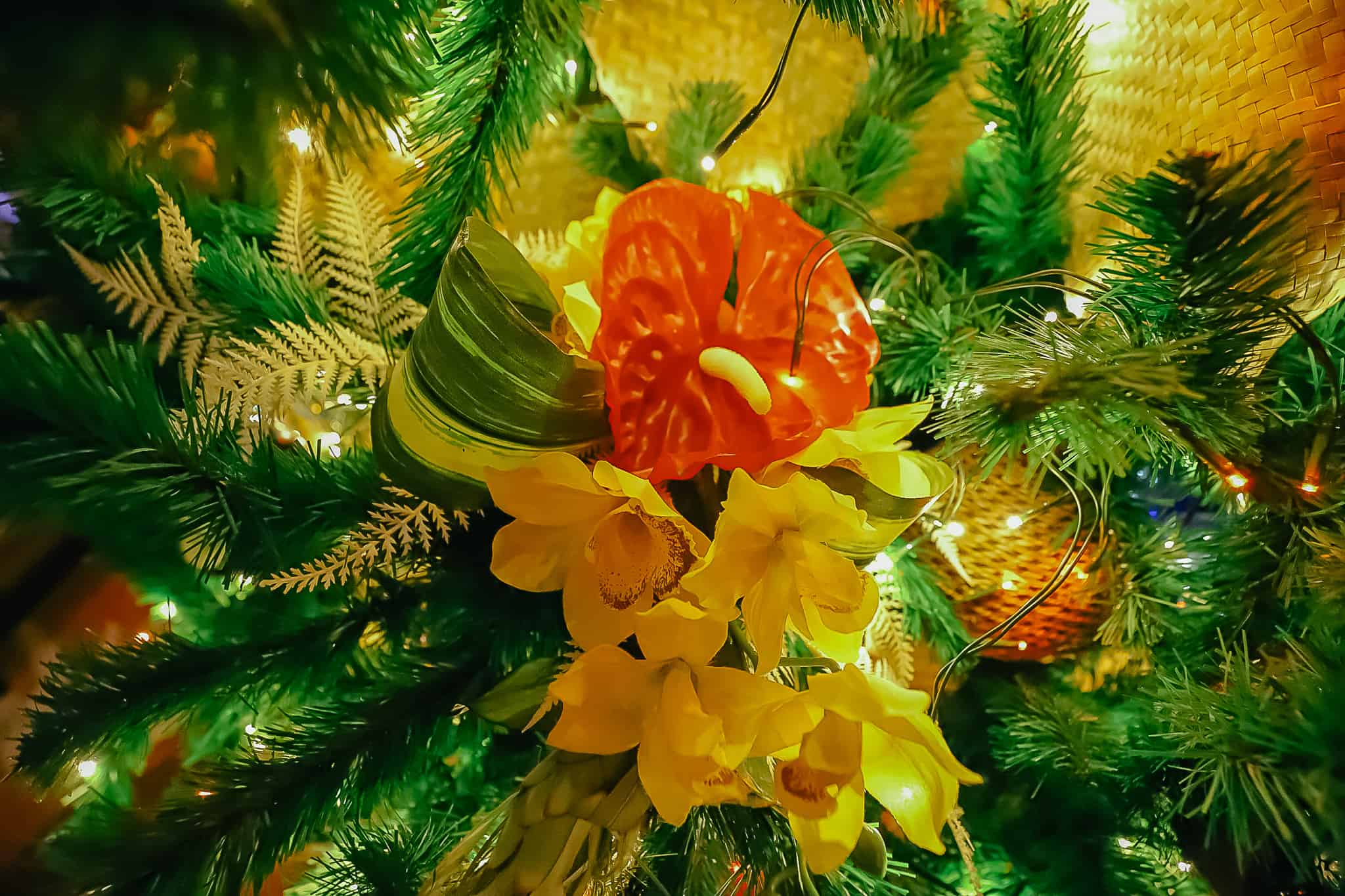 Tropical flowers and orchids placed in the Polynesian's Christmas Tree. 