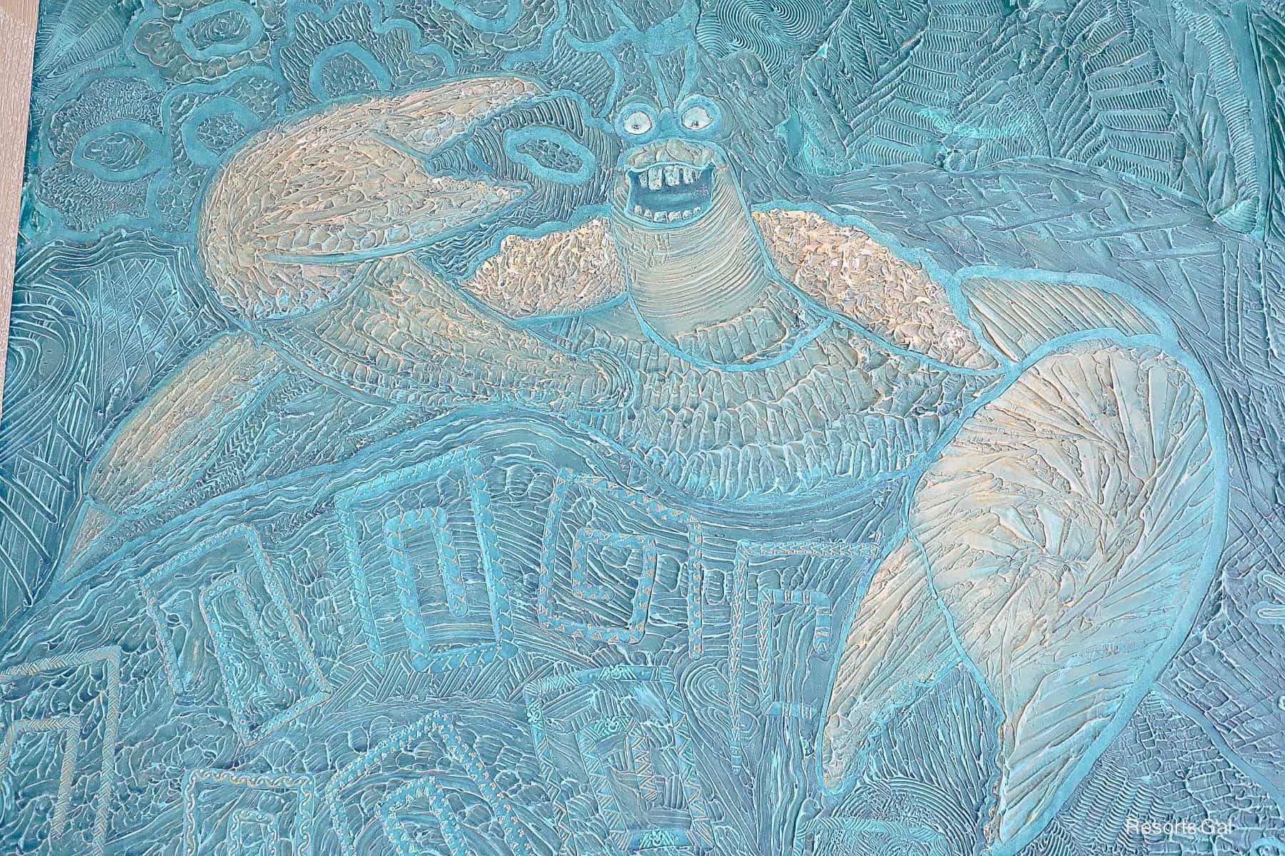 Tamatoa, the crab from the original Moana within the mural at the Island Tower lobby