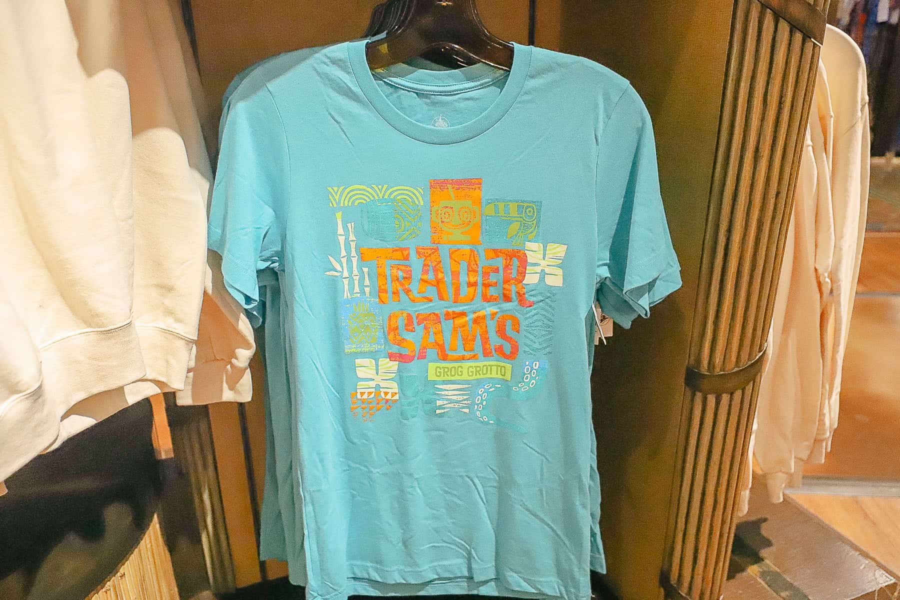 a blue shirt with Trader Sam's Grog Grotto written on it