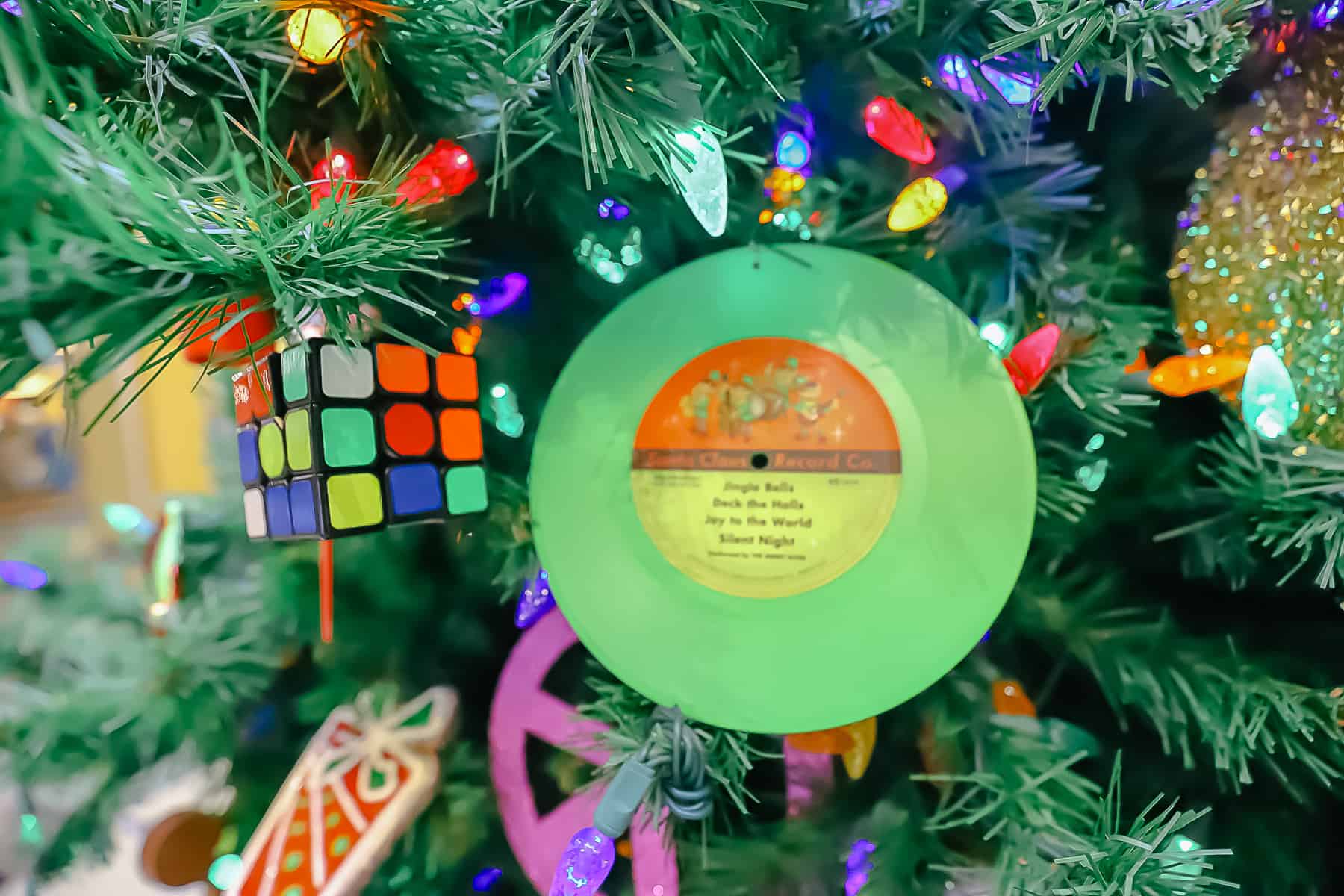 An old fashioned record and Rubik's cube decorate the tree at Pop Century. 