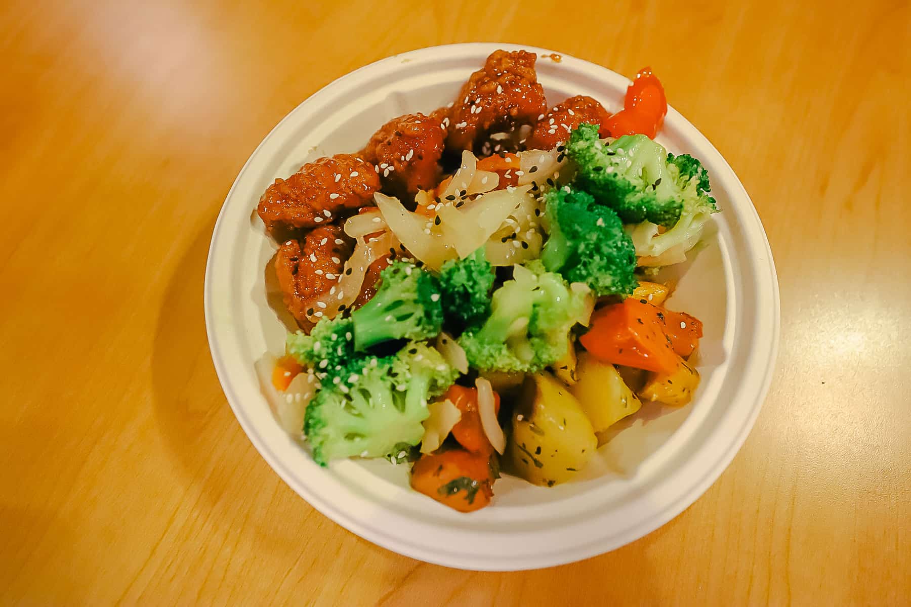 an item from the food court at Pop Century Resort with chicken and vegetables 
