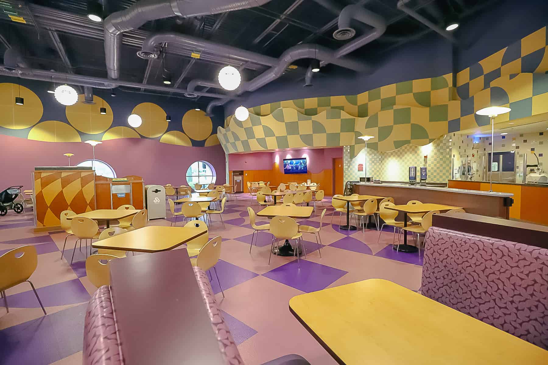 tables and chairs in the food court 