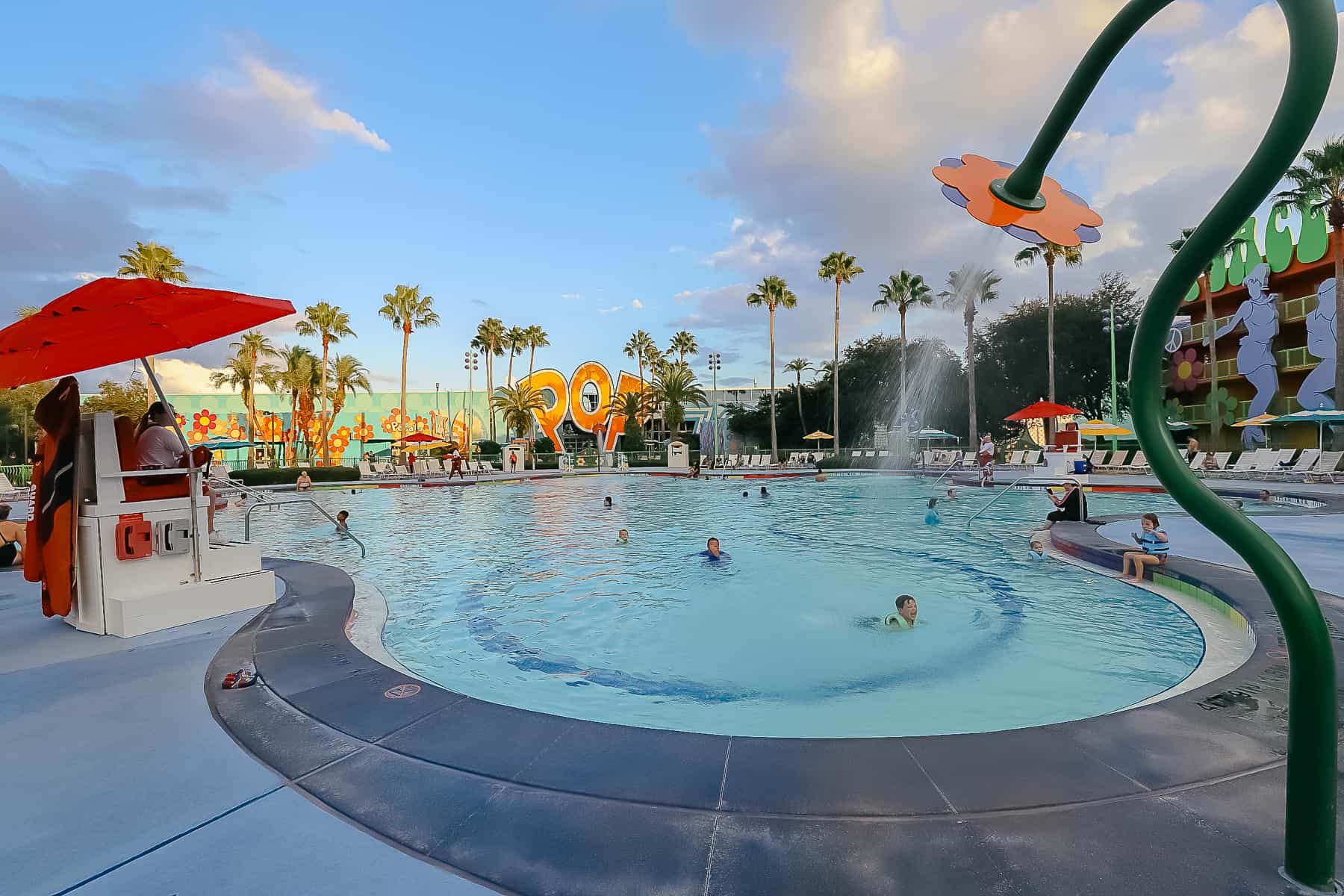 A pool at Pop Century with flower-shaped water jets. 