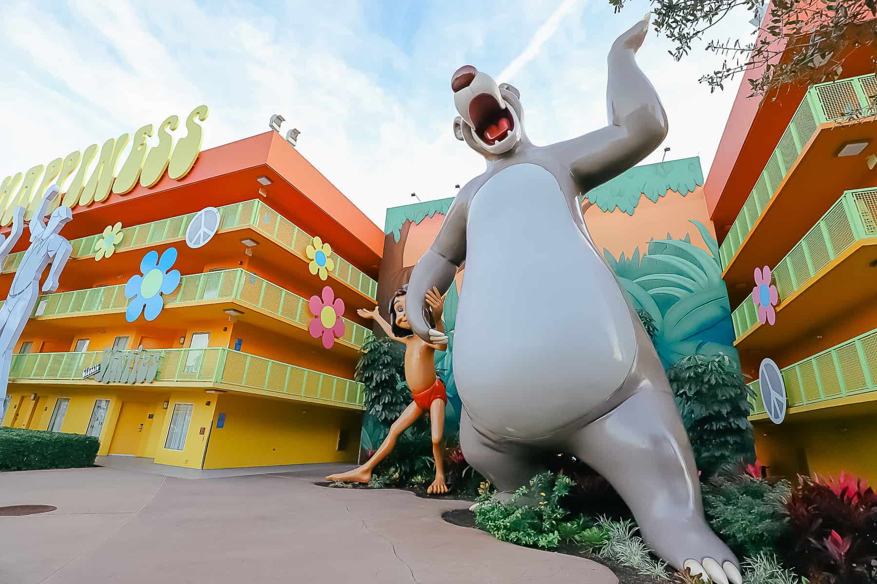 Statues of Mowgli and Baloo at Pop Century 