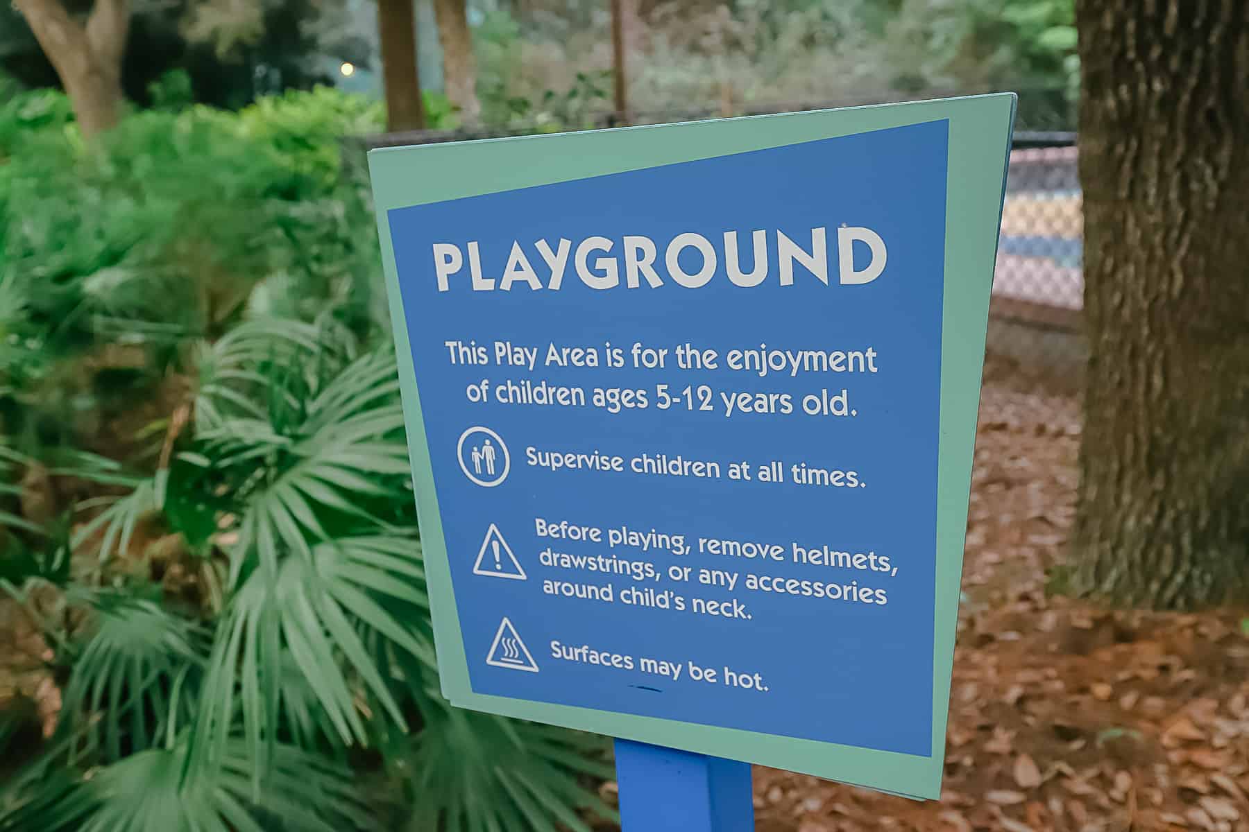 a sign that reads the playground at Pop Century is for the enjoyment of children ages 5-12 years old.