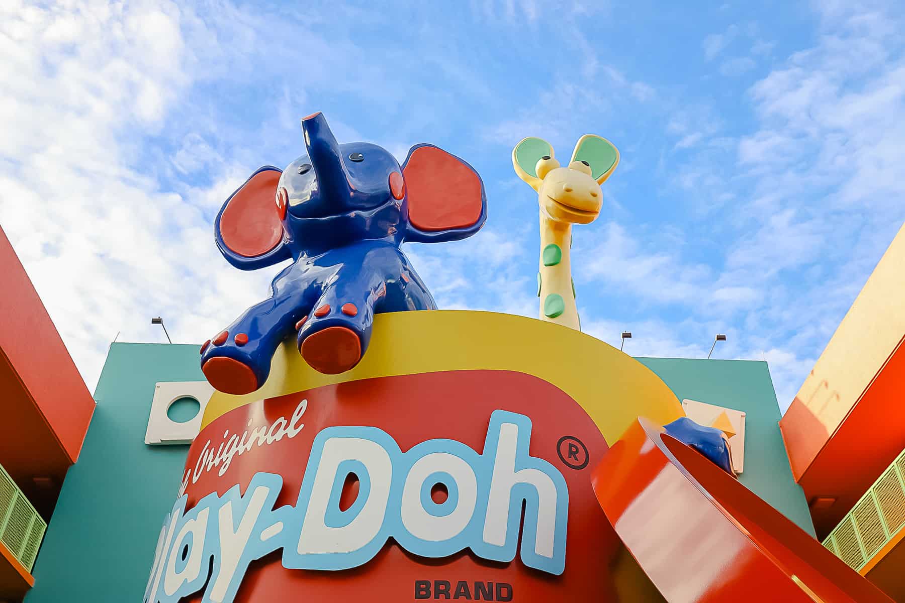 giant cup of Play-doh with an elephant and giraffe at Pop Century 