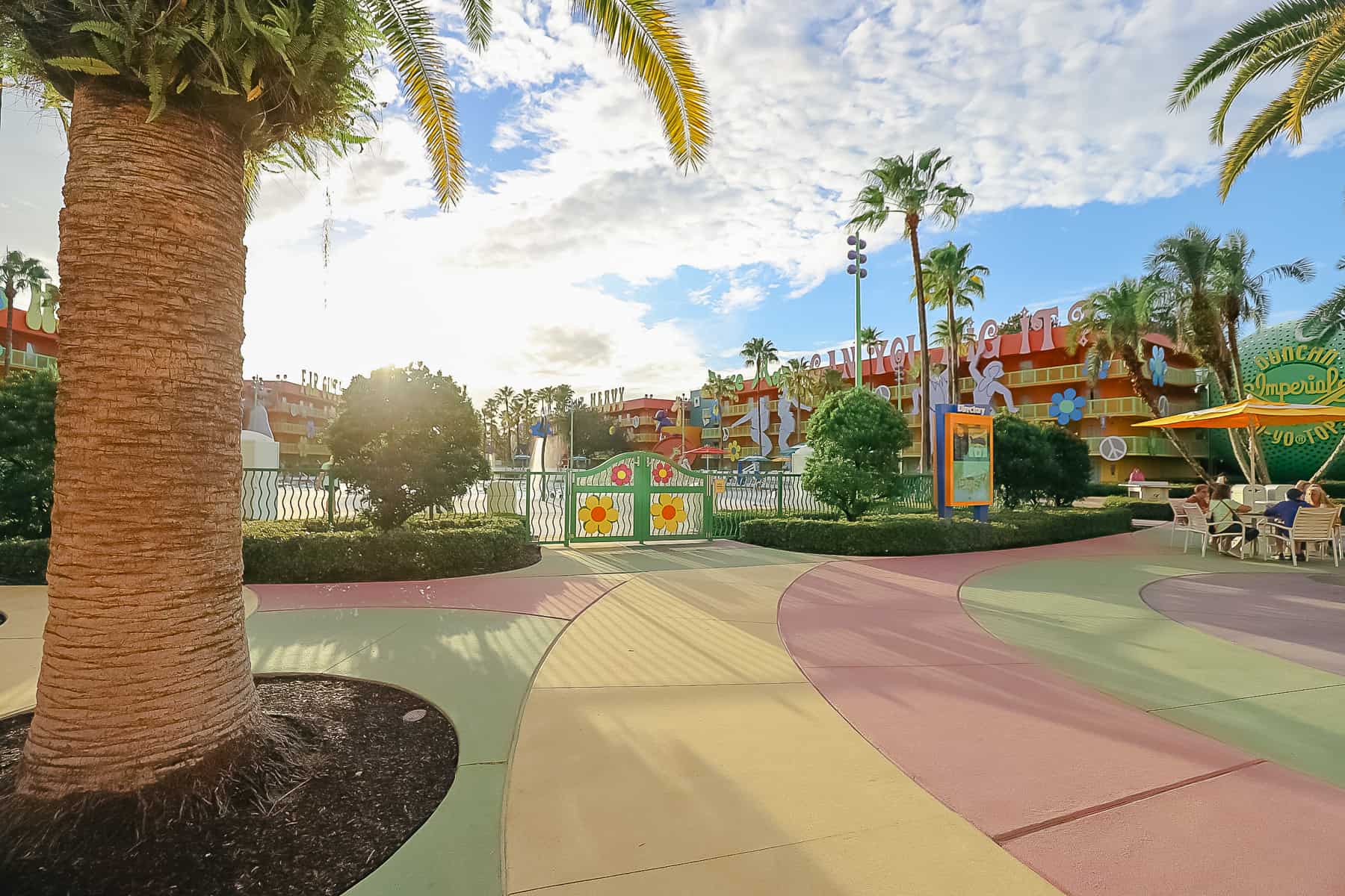 the outside area between the lobby and feature pool at Pop Century 