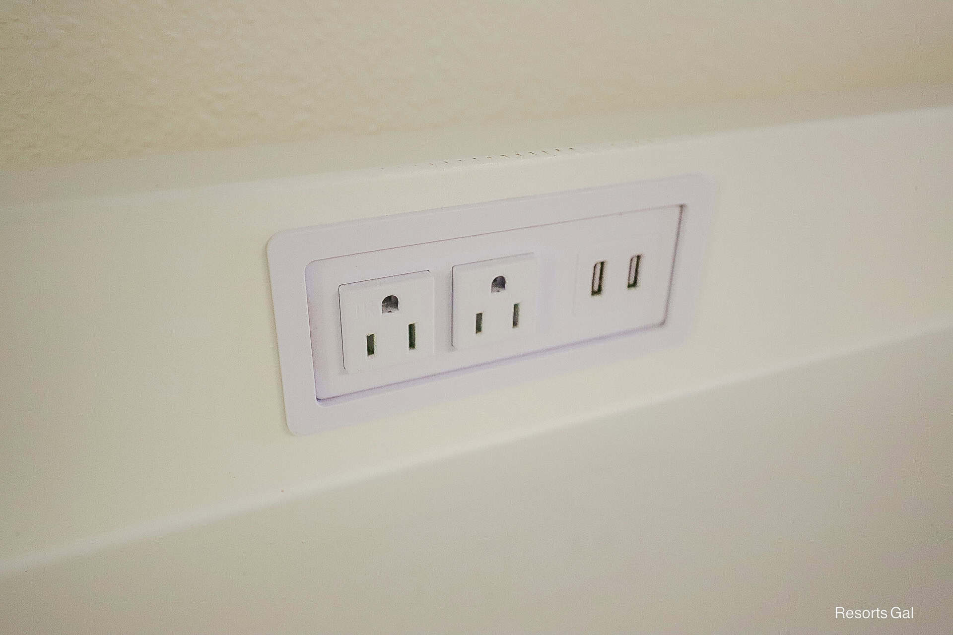 one of two sets of outlets and USB ports built in over the dresser 